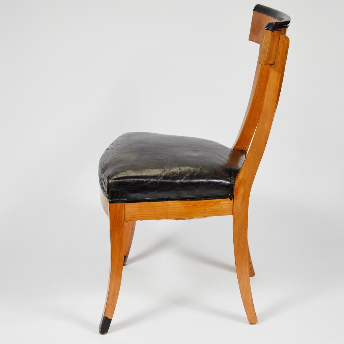 vintage chairs with an upholstered leather seat