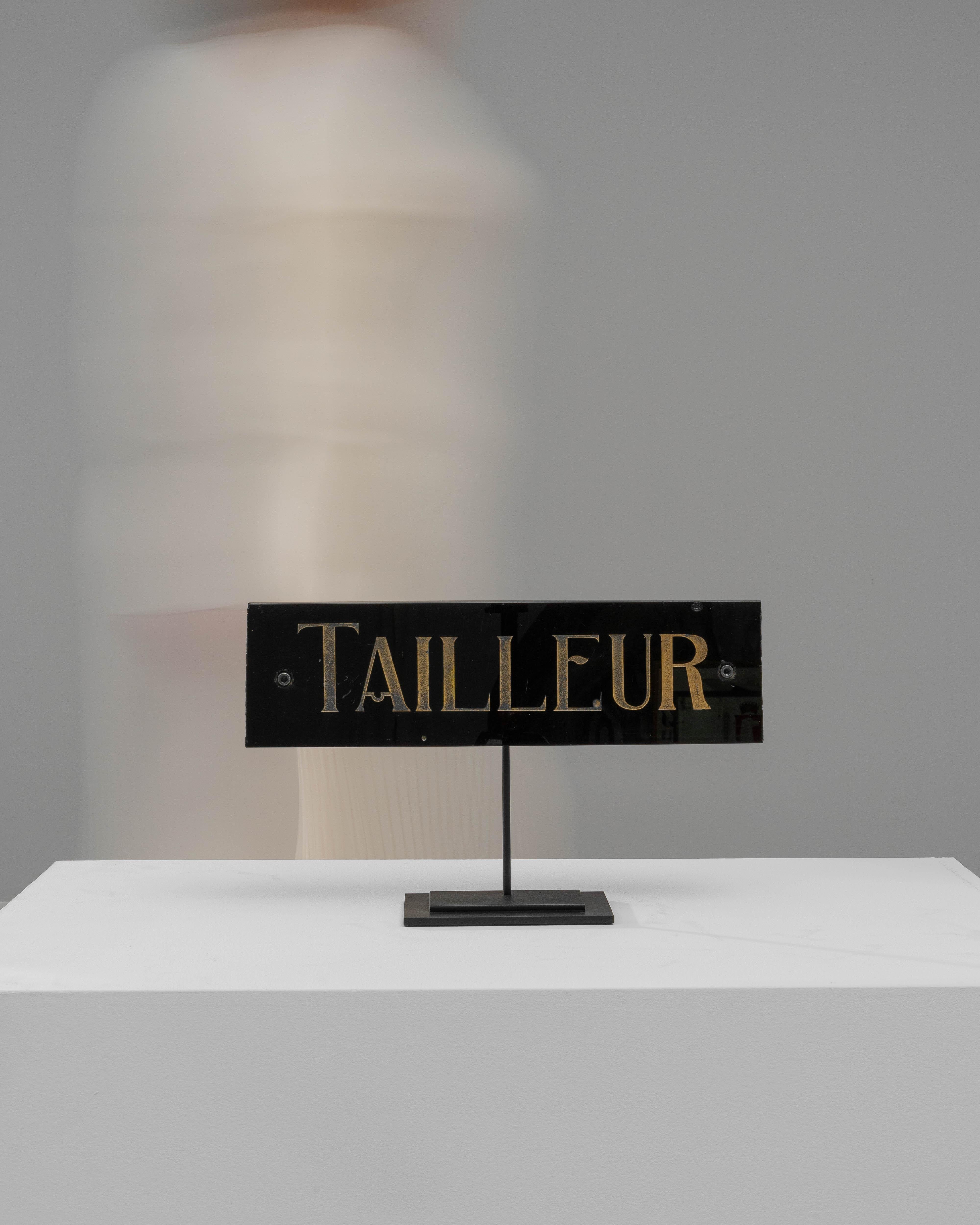 Discover the understated elegance of this 1900s French Marble Decoration On Metal Stand, graced with the word 
