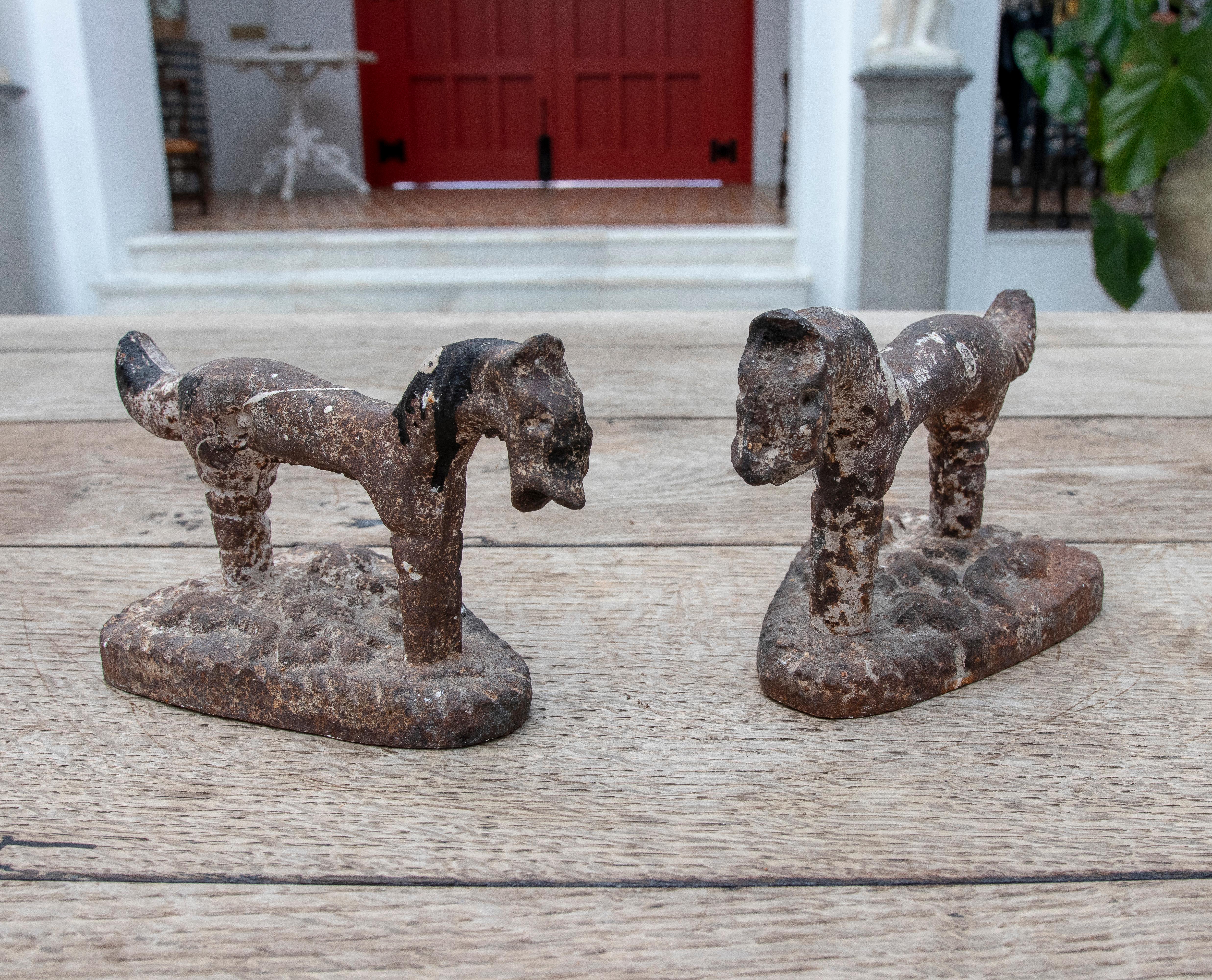 1900s French pair of iron horse door holders.