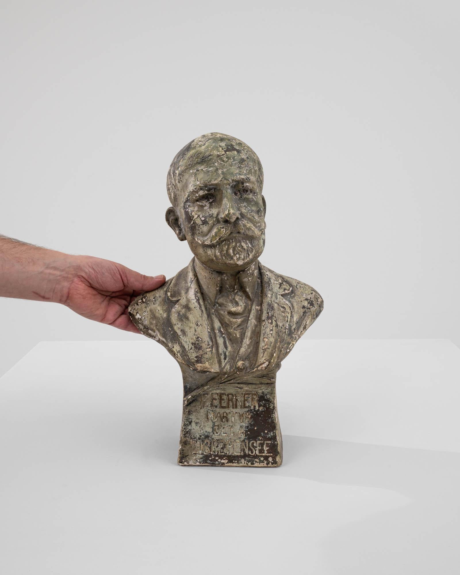 This 1900s French plaster bust offers a unique glimpse into the past, capturing the detailed likeness of an esteemed figure from the early 20th century. Crafted with meticulous care, the bust features a weathered finish that enhances its vintage