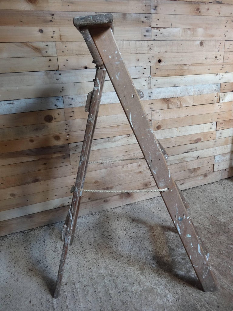 1900s French vintage fruit picking / painting ladder. 
1900s French vintage artists painting ladder library steps / shop display

This ladder will be great as an vintage library steps
It is sturdy and usable.

Measures: Height 111cm, depth 73cm,