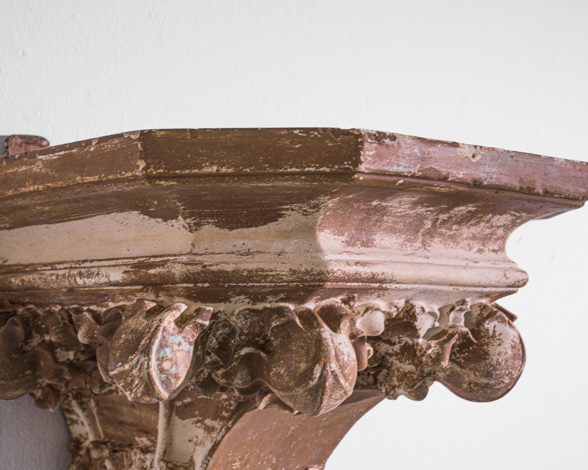 This 1900s French wall plaster pedestal brings the allure of antiquity straight into the modern home. Crafted with meticulous attention to detail, the pedestal showcases a rich tapestry of textures, from the ornate acanthus leaves to the classic