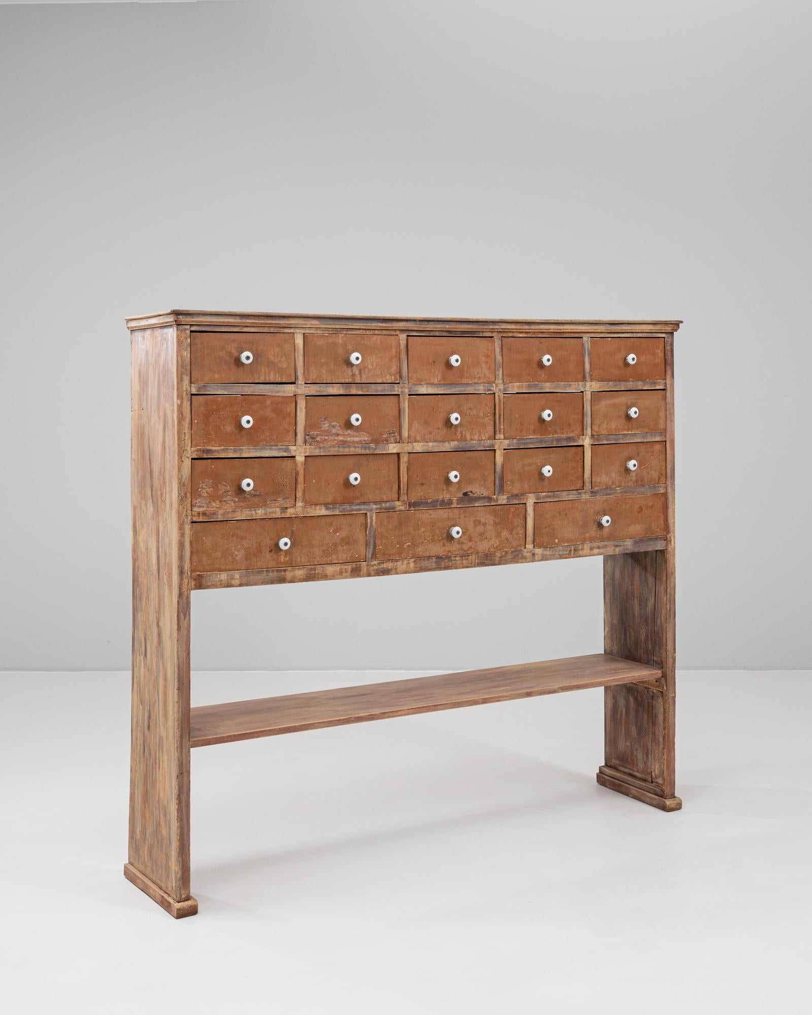 Legno 1900s French Wooden Pharmacy Chest Of Drawers in vendita