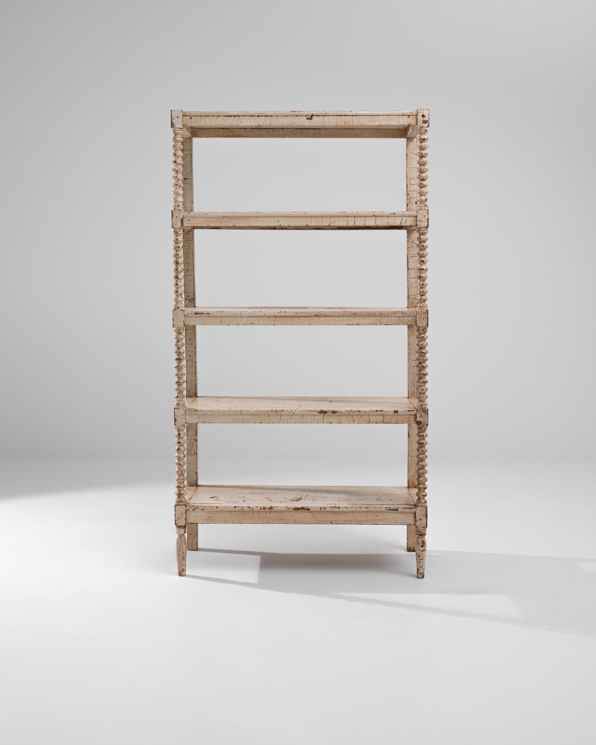 These antique wooden shelves were produced in France, circa 1900. A beautiful wooden five-shelf unit standing on ring turned tapered feet, this twisted piece elevates slightly under six feet and provides for a spacious display surface. The playfully