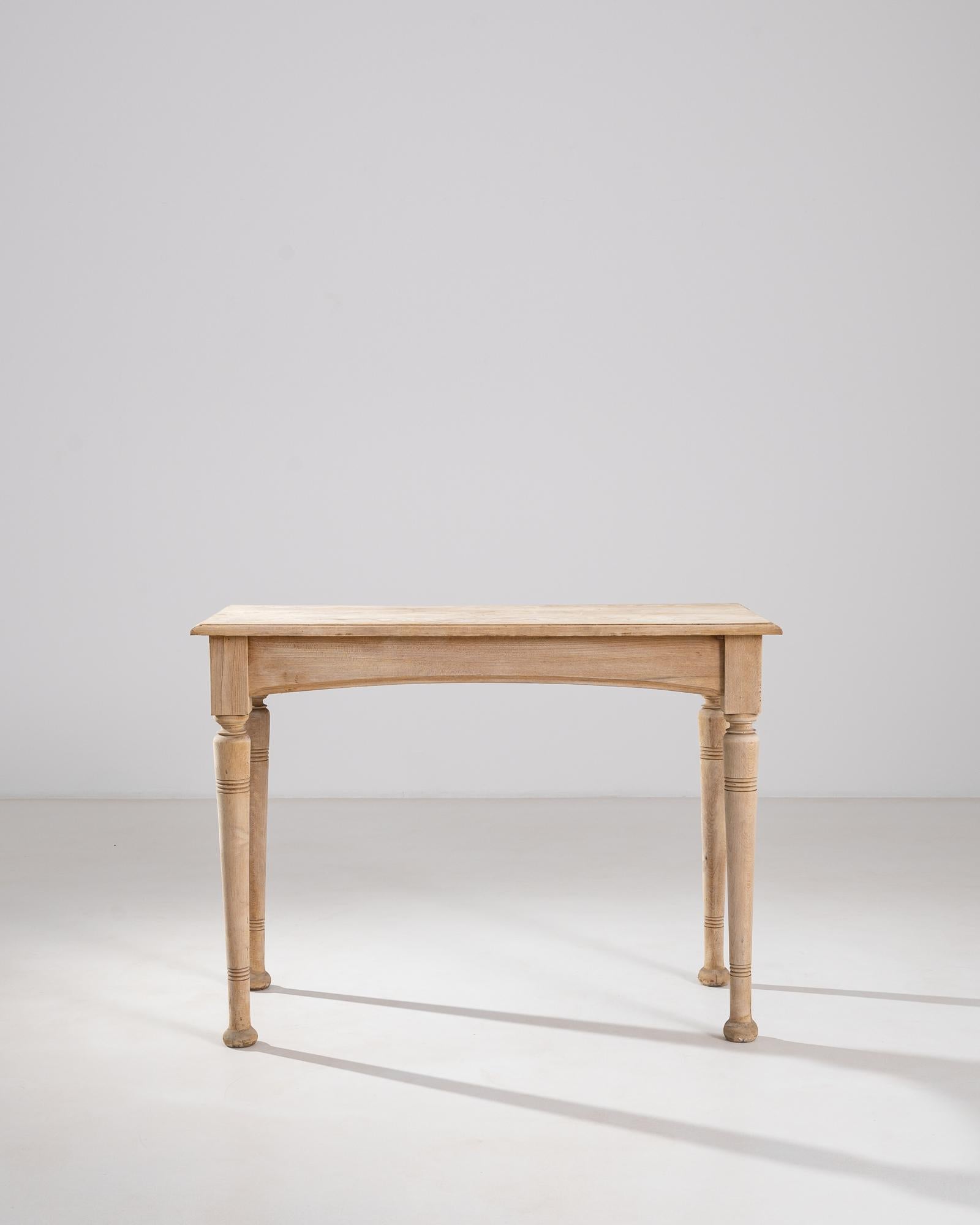This enchanting table was made in France circa 1900. Turned legs make an elegant effect, enhancing the clean lines of the piece’s silhouette, for an engaging and composed piece of furniture. The wood has been refreshing in our atelier, hues of ash
