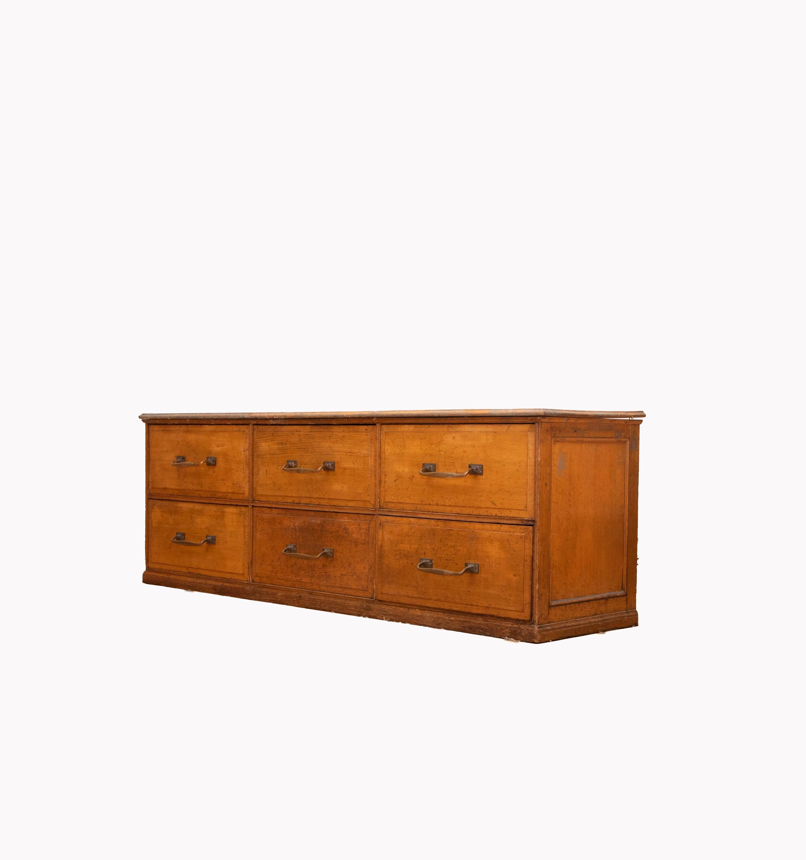Great set of vintage, early  1900s haberdashery drawers from an old textile factory. 
Solid wooden top, sides and drawers, with brass handles. Pine clad back panel. 
Ideal kitchen island.
Perfect for retail or hospitality environment. 
We have