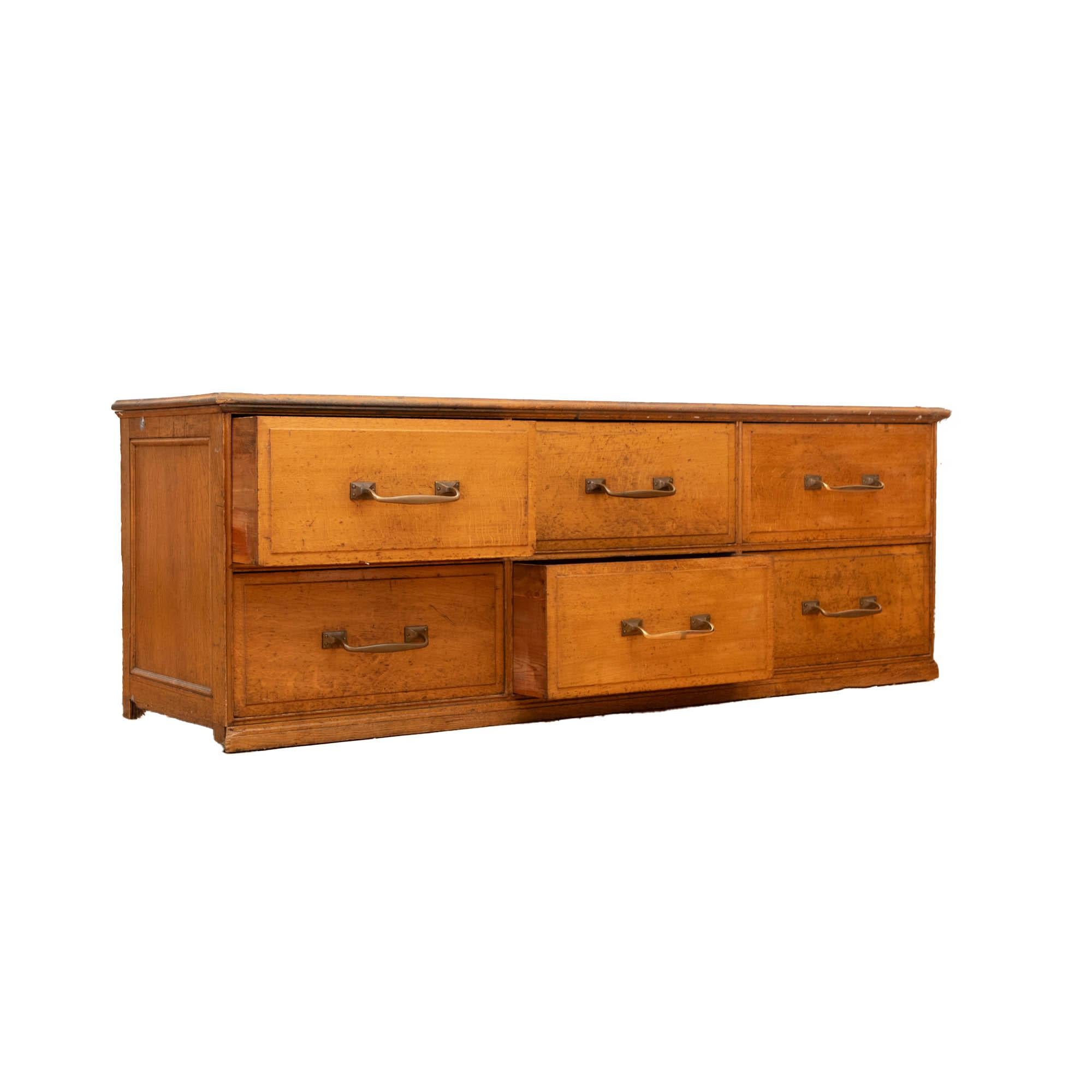 Great set of vintage, early  1900s haberdashery drawers from an old textile factory. 
Solid wooden top, sides and drawers, with brass handles. Pine clad back panel. 
Ideal kitchen island.
Perfect for retail or hospitality environment. 
We have