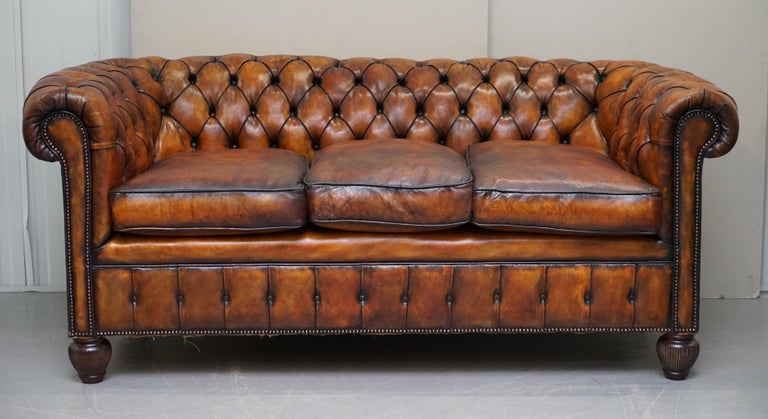 We are delighted to offer for sale this stunning fully restored circa 1900 hand dyed whiskey brown leather Chesterfield sofa with feather filled cushions

This sofa is one of the nicest I have seen in terms of original patina, it looks and feels