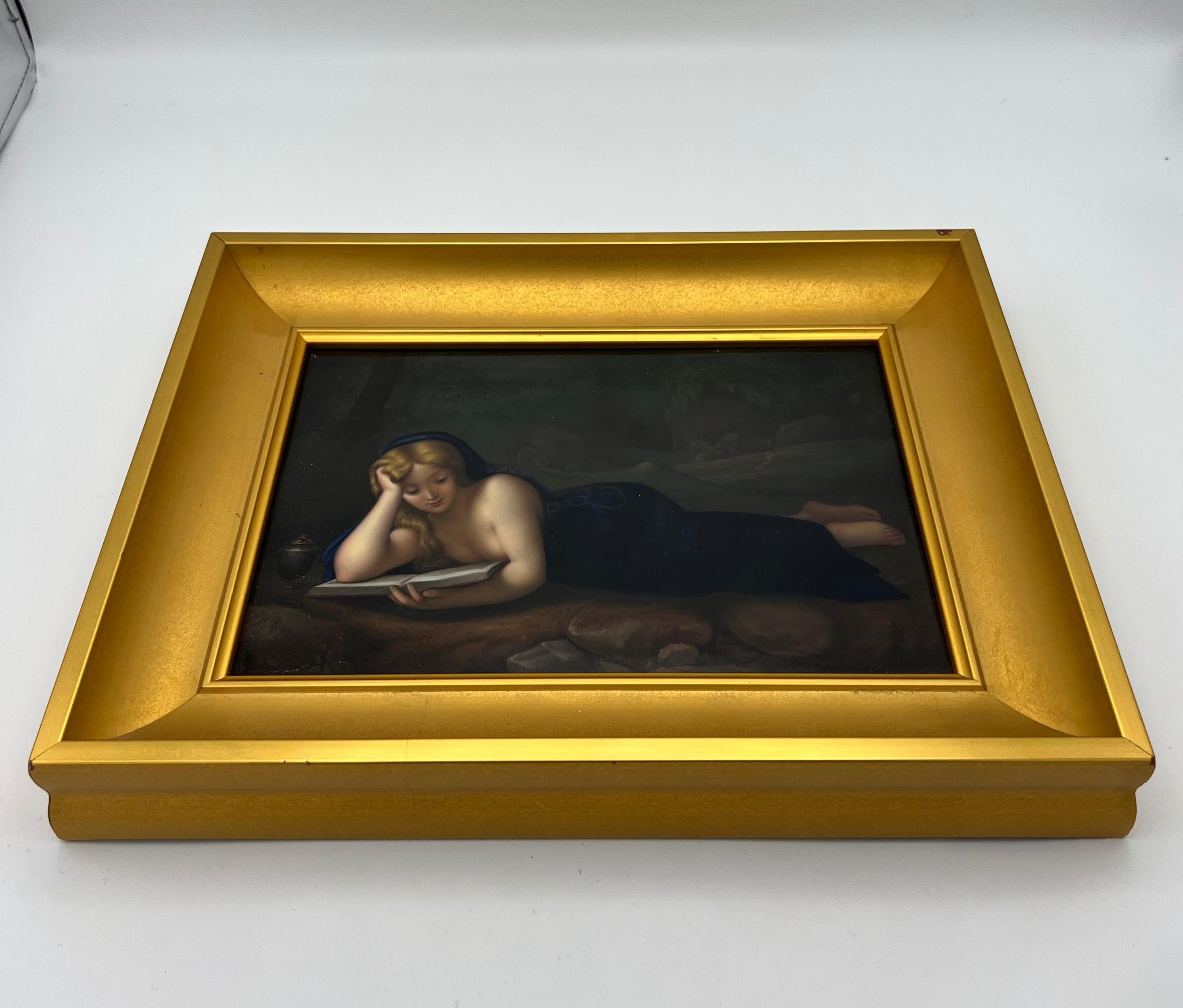 The art work features a hand painted reclining woman reading a book on porcelain plaque with gold leaf frame.
Made in Germany.
Signed by K.P.M. (Konigliche Porzellan Manufaktur).