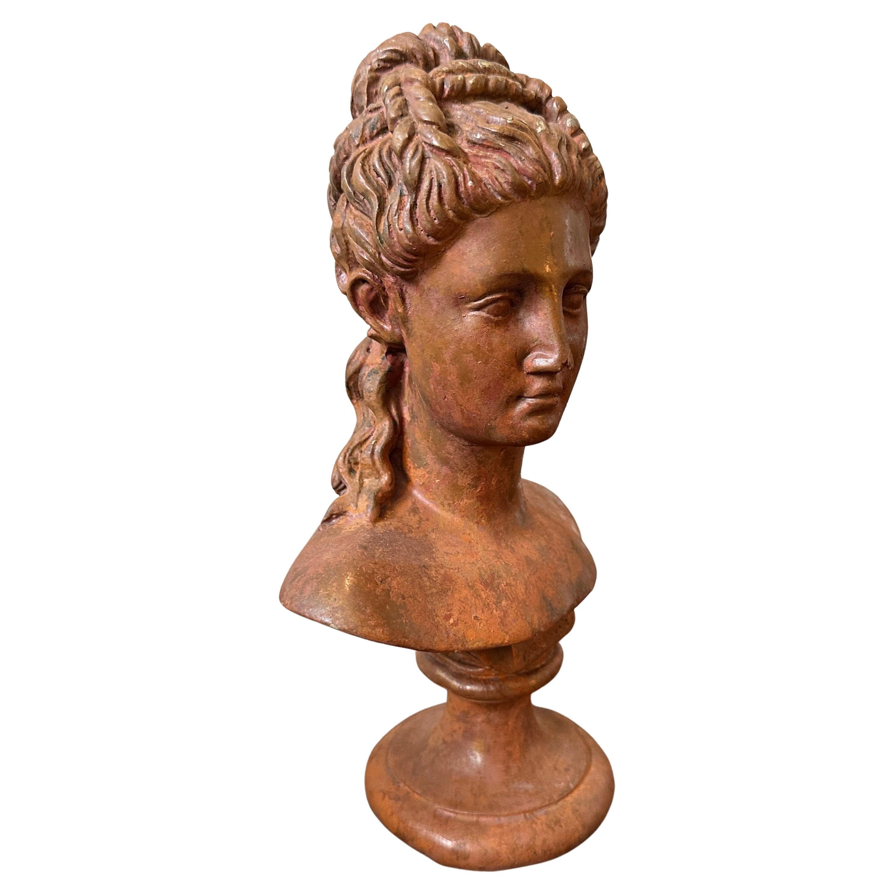 A red patina metal bust of a woman manufatured in Italy in early 19th century, good conditions overall, metal it has this brick red patina probably due to exposure to the natural elements. The Woman bust  is an exquisite piece of art that embodies