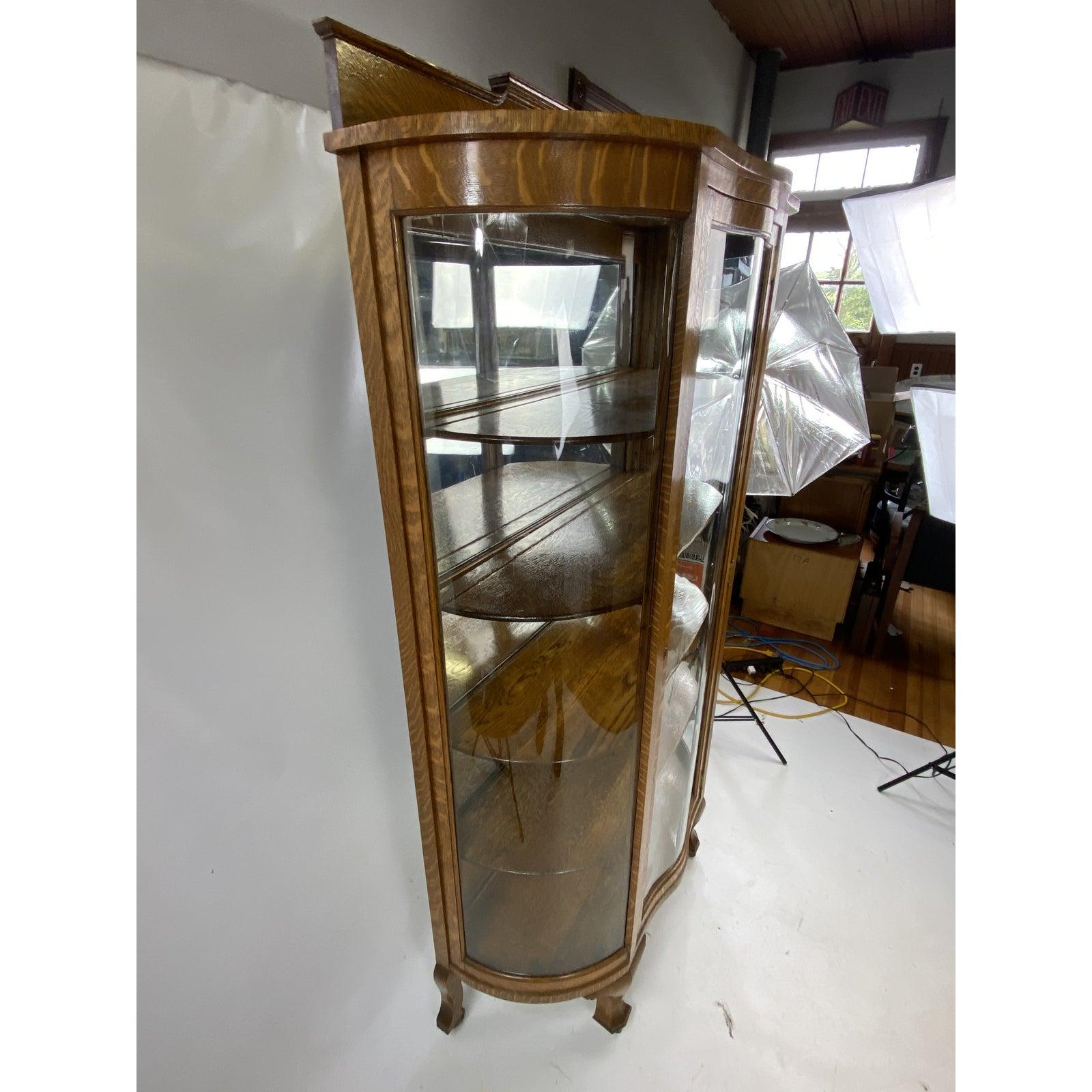 For sale is this very nice antique china cabinet. The cabinet has been restored in the past 15 years. Very well done. Very unique double bow curved front door.