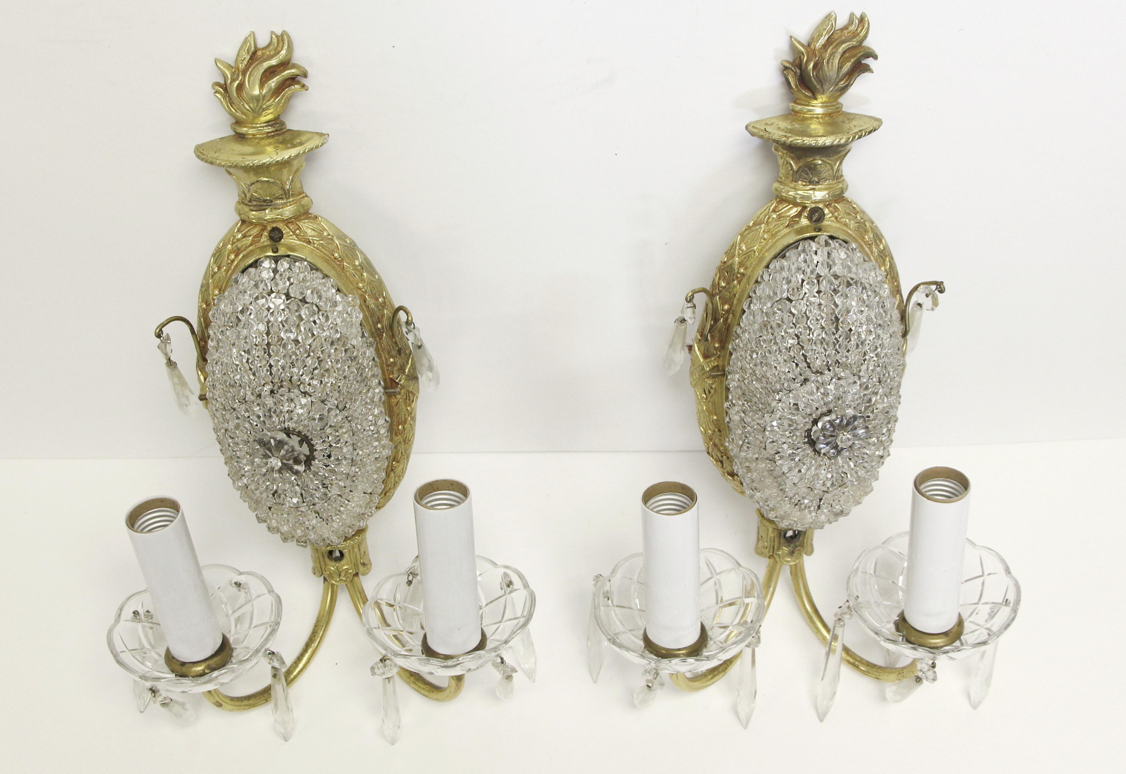 1900s pair of two arm sconces made of beaded crystal gold gilded bronze from France. These sconces were recently fully restored. Priced as a pair. Please note, this item is located in our Scranton, PA location.