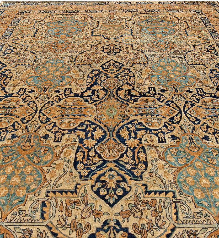 Authentic 1900s Persian Kirman botanic handmade wool carpet
Size: 9'9