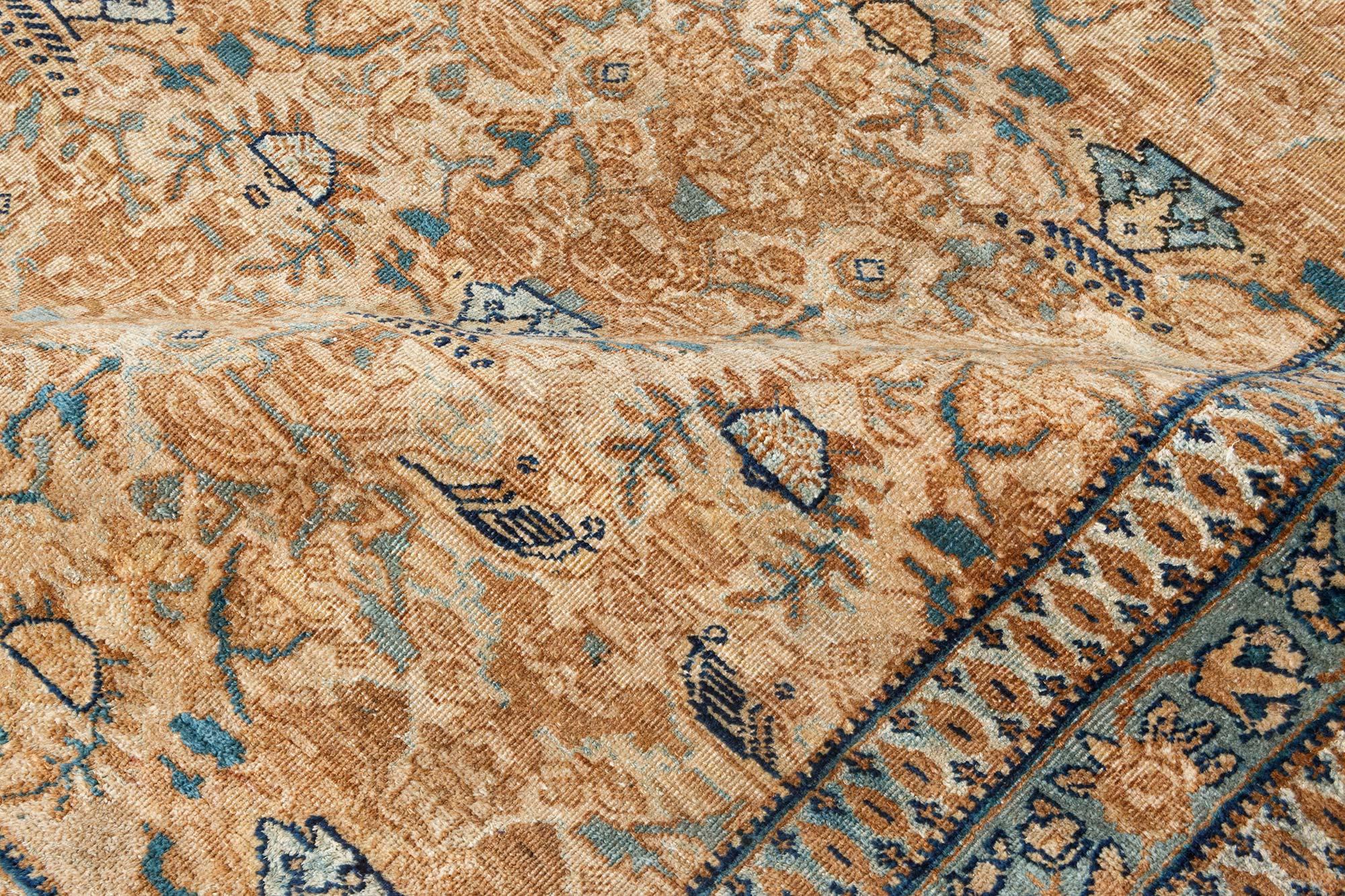 Authentic 1900s Persian Kirman handmade wool carpet
Size: 10'1