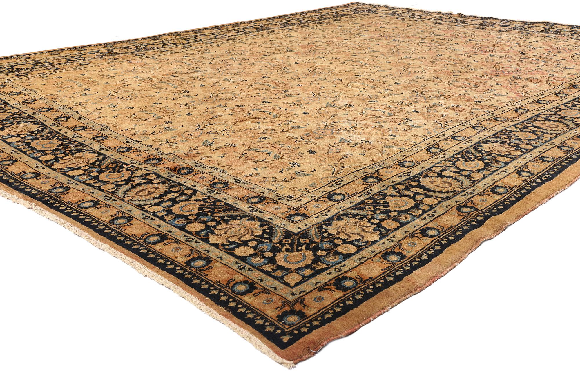 75596 Antique Persian Mashhad Rug, 10'08 x 13'08. This hand-knotted wool antique Persian Mashhad rug exudes an air of timeless elegance, showcasing the classic Gol Farang design, a style renowned for its European-inspired floral motifs. Set against