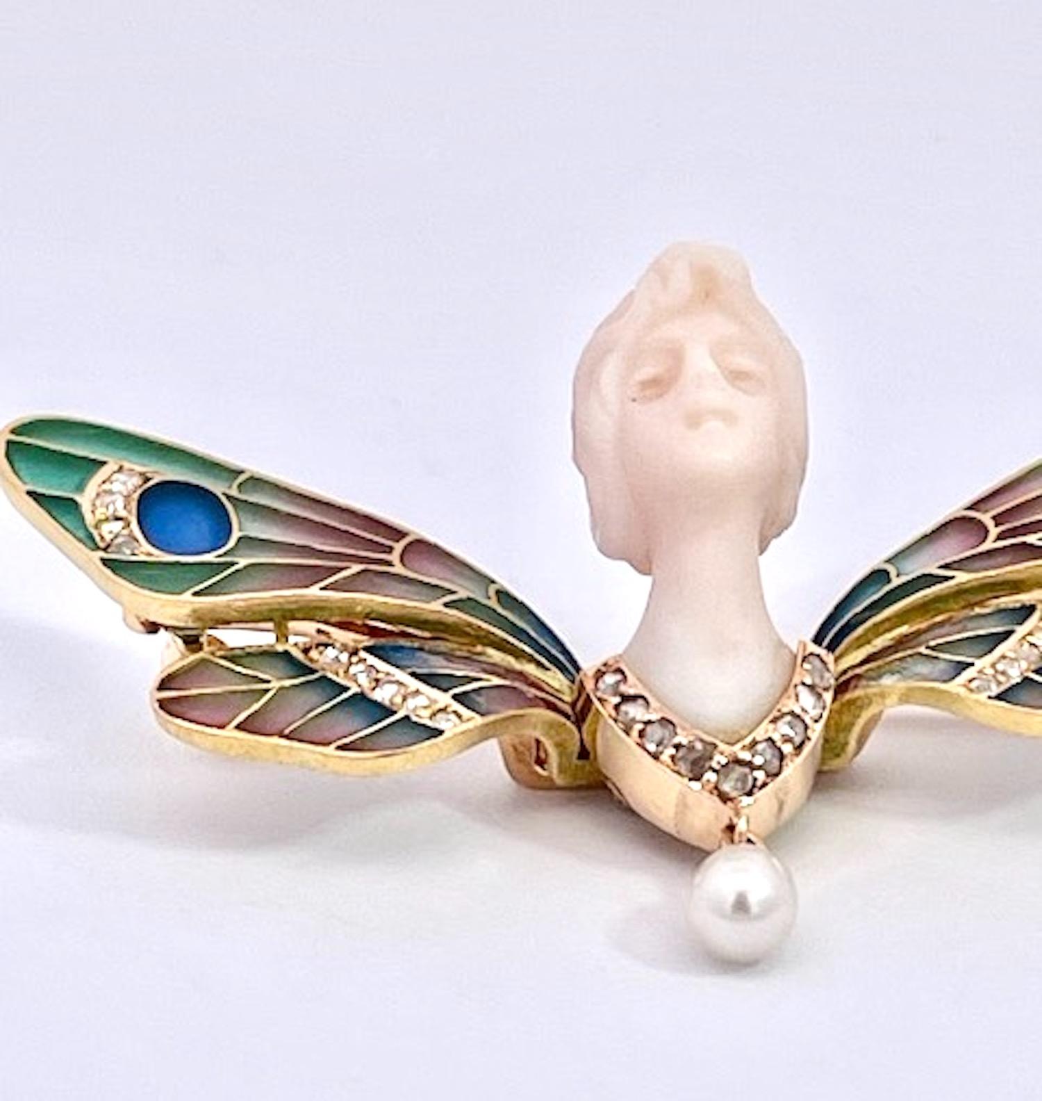 This piece is wonderful a plique a jour Butterfly with a carved Chalcedony Ladies Face.  This is in the likes of Lalique, Vever, Gaillard and Fouquet which were masters of Art Nouveau Jewelry.  These firms made items similar to this listing.  This