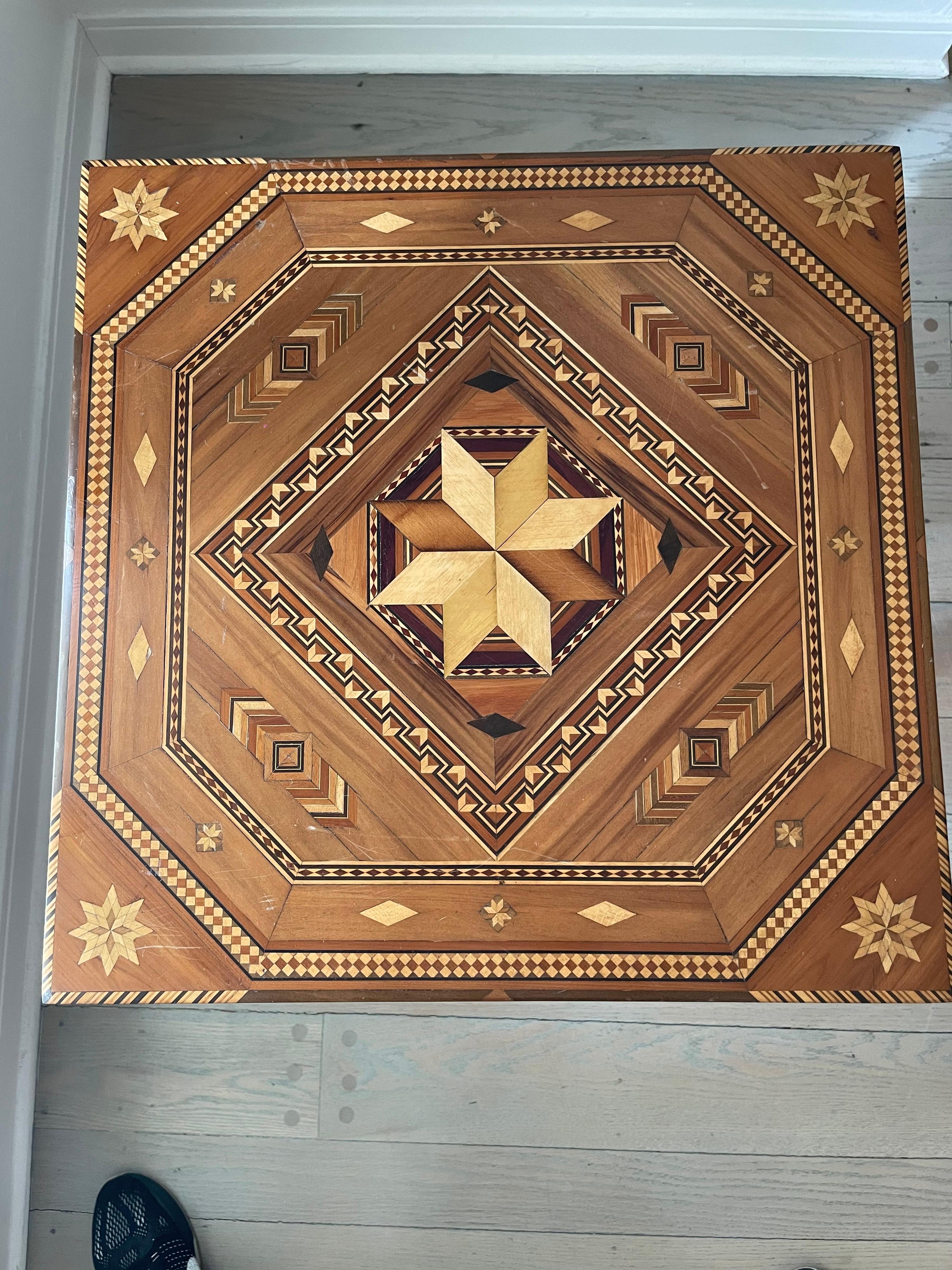 An exceptional feat of craftsmanship in exotic woods inlay marquetry side table/accent table with 2 lined drawers. This was made circa 1900s. Note: there is a companion piece available which is a tiered box made in the same woods and design by same