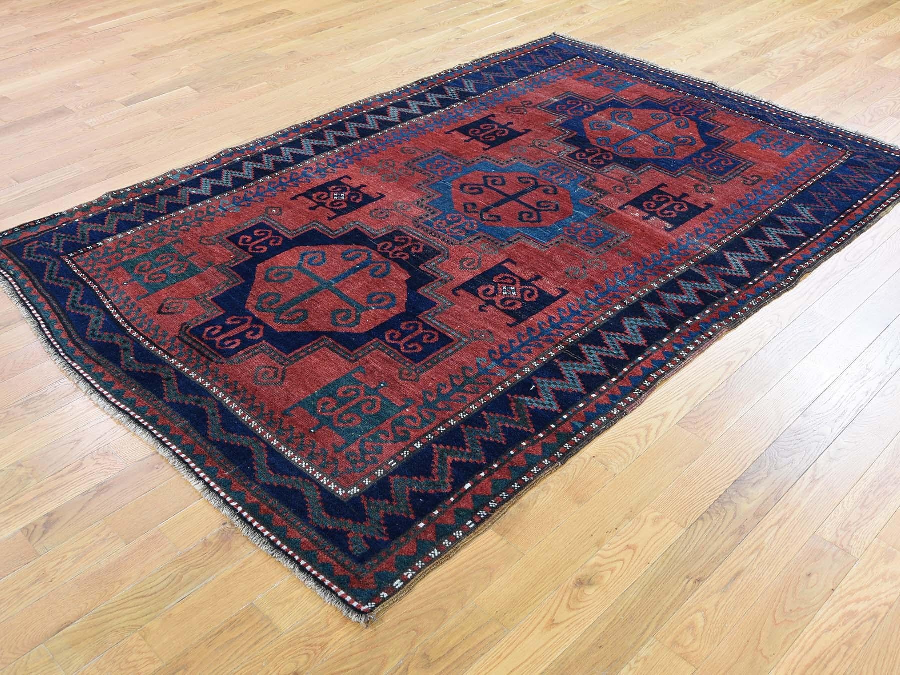 This is a genuine hand knotted oriental rug. It is not hand tufted or machine made rug. Our entire inventory is made of either hand knotted or handwoven rugs. 

Start a new room with this wonderful hand knotted red antique Persian Caucasian, it is