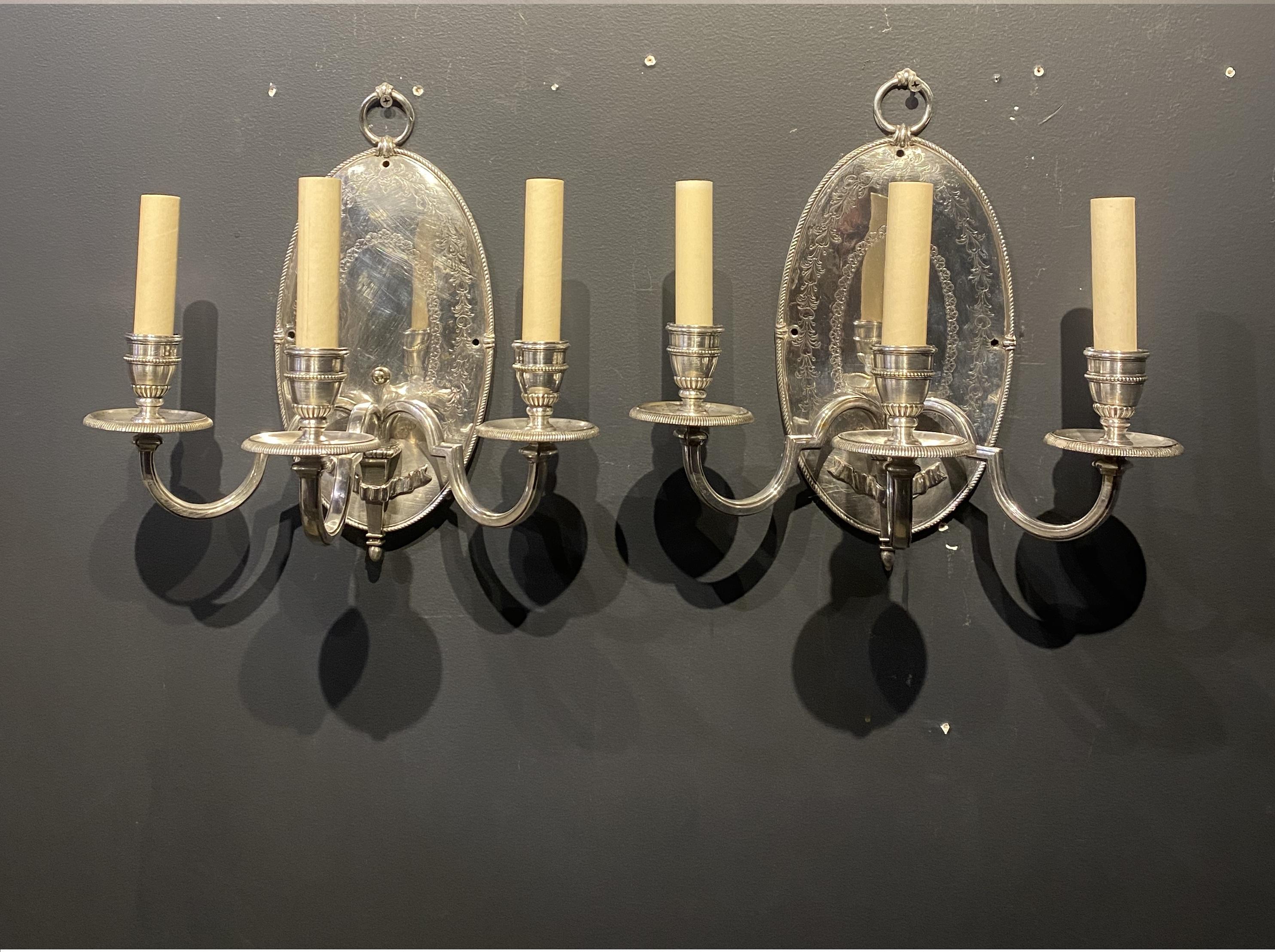 A pair of circa 1900 Caldwell silver plated sconces with 3 arms 