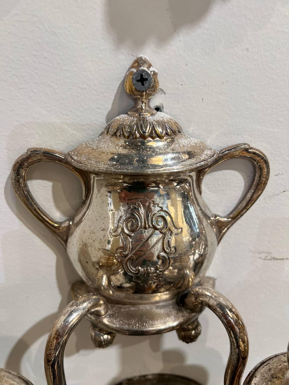 A pair of 1900 silver plated sconces with tea pot shape and two lights 