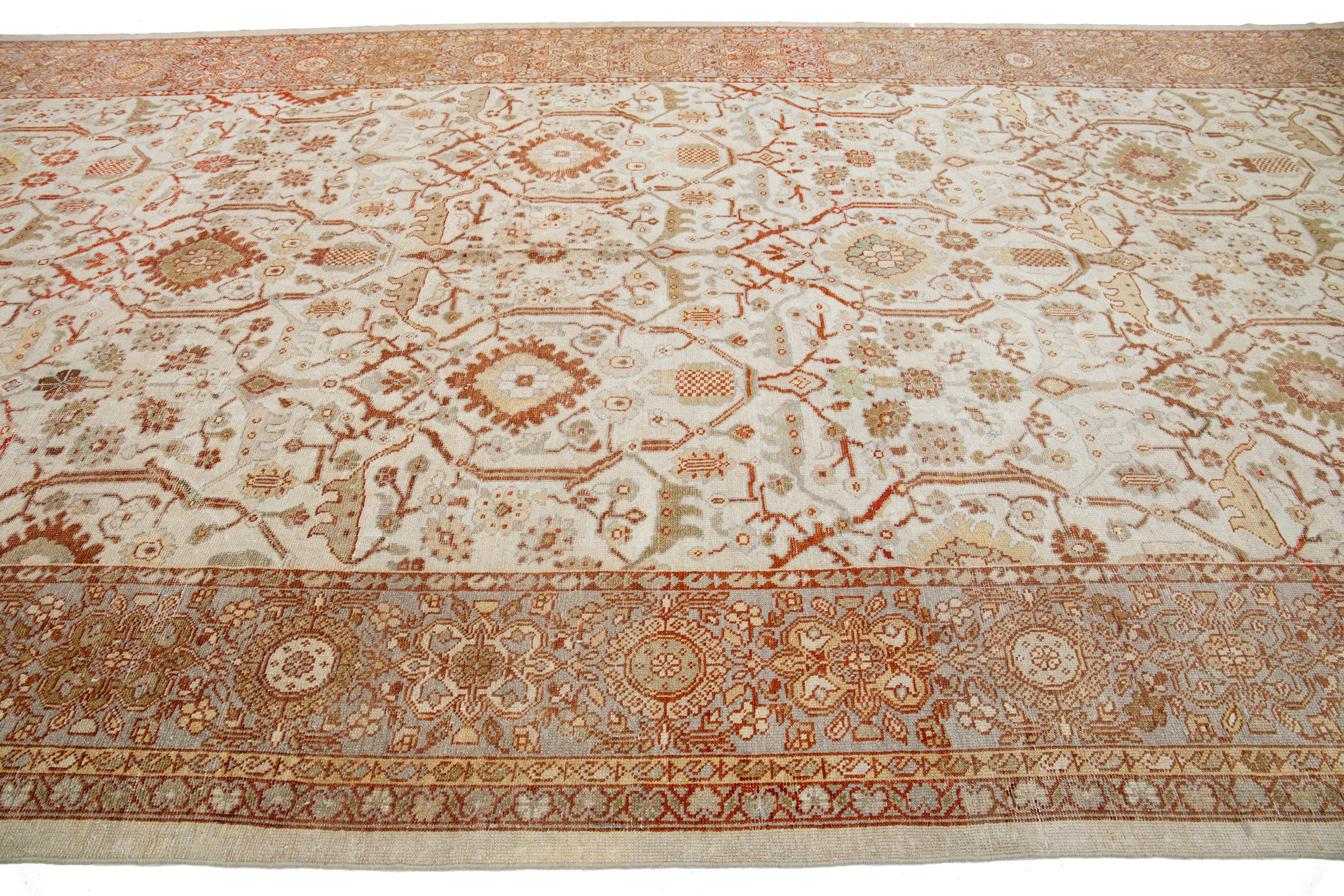 Hand-Knotted 1900s Sultanabad Persian Gallery Wool Rug In Beige and Orange With Floral Motif For Sale