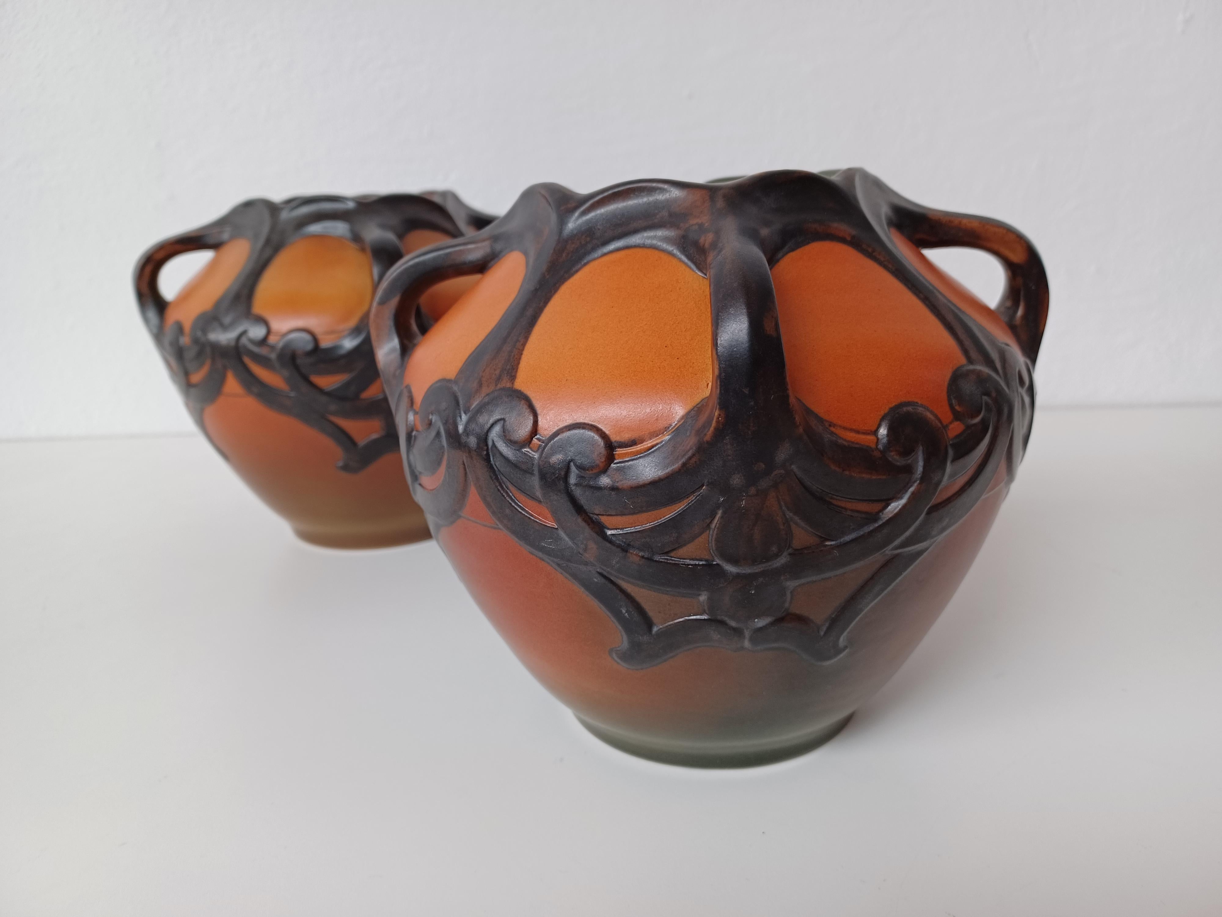 1909 Two Karen Hagen Hand-Crafted Danish Art Nouveau Vases by P. Ipsens Enke

The hand-crafted art nouveau vases feature art nuveau pattern with 4 handles as integrated part of the decoration are in very good condition.

P. Ipsens Enke (1843 - 1955)