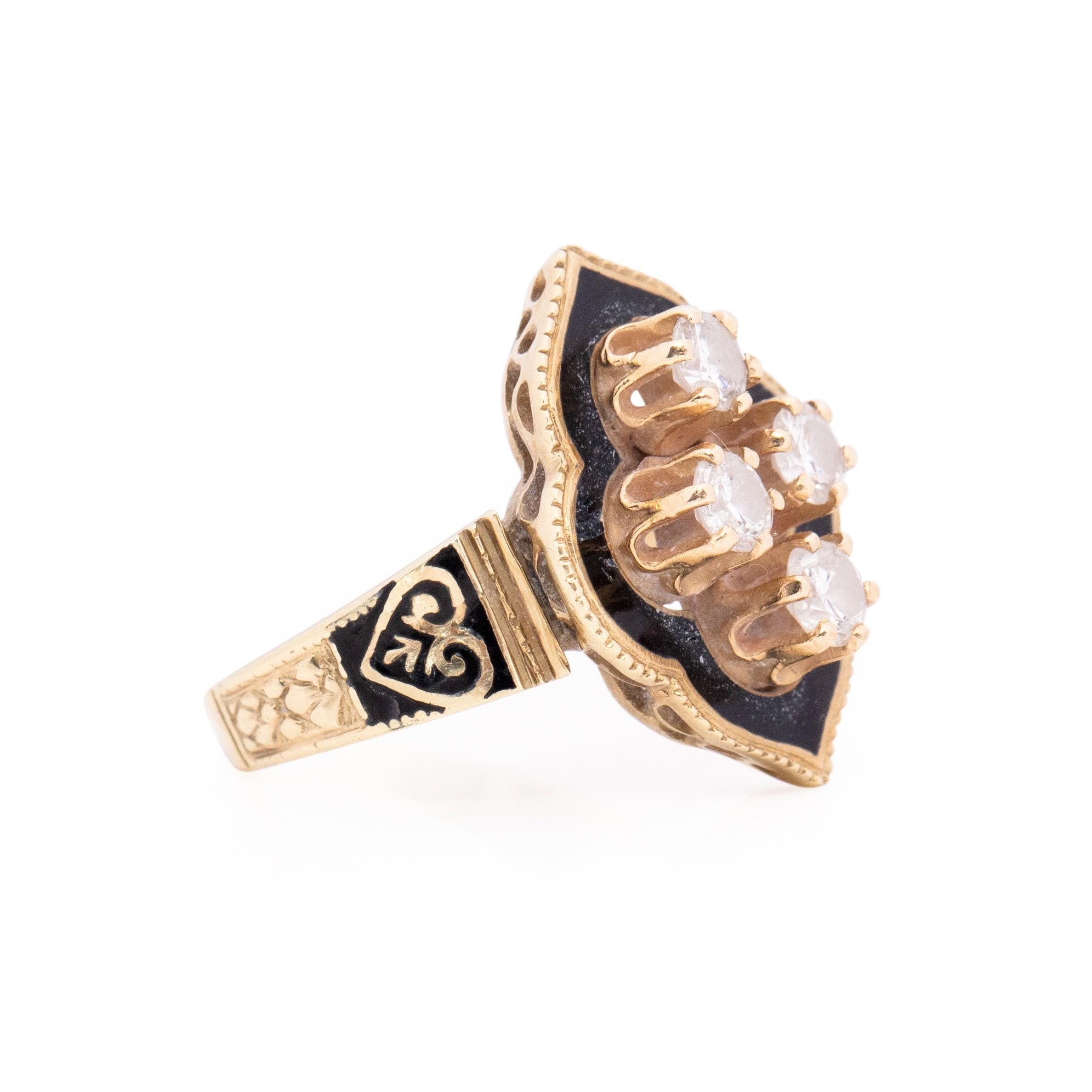 This Victorian piece is a true eye catcher, all the designs work perfectly together to result in this beautiful antique look. Crafted in 14K yellow gold with black enamel accents. The over all shape of the gallery is a alhambra with a simple