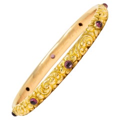 1900s Victorian Garnet Cabochon 14 Karat Gold Floral Foliate Bangle Bracelet