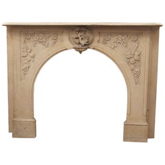 1900s Victorian Hand Carved Tan Arched Marble Mantel with Bird and Floral Motif