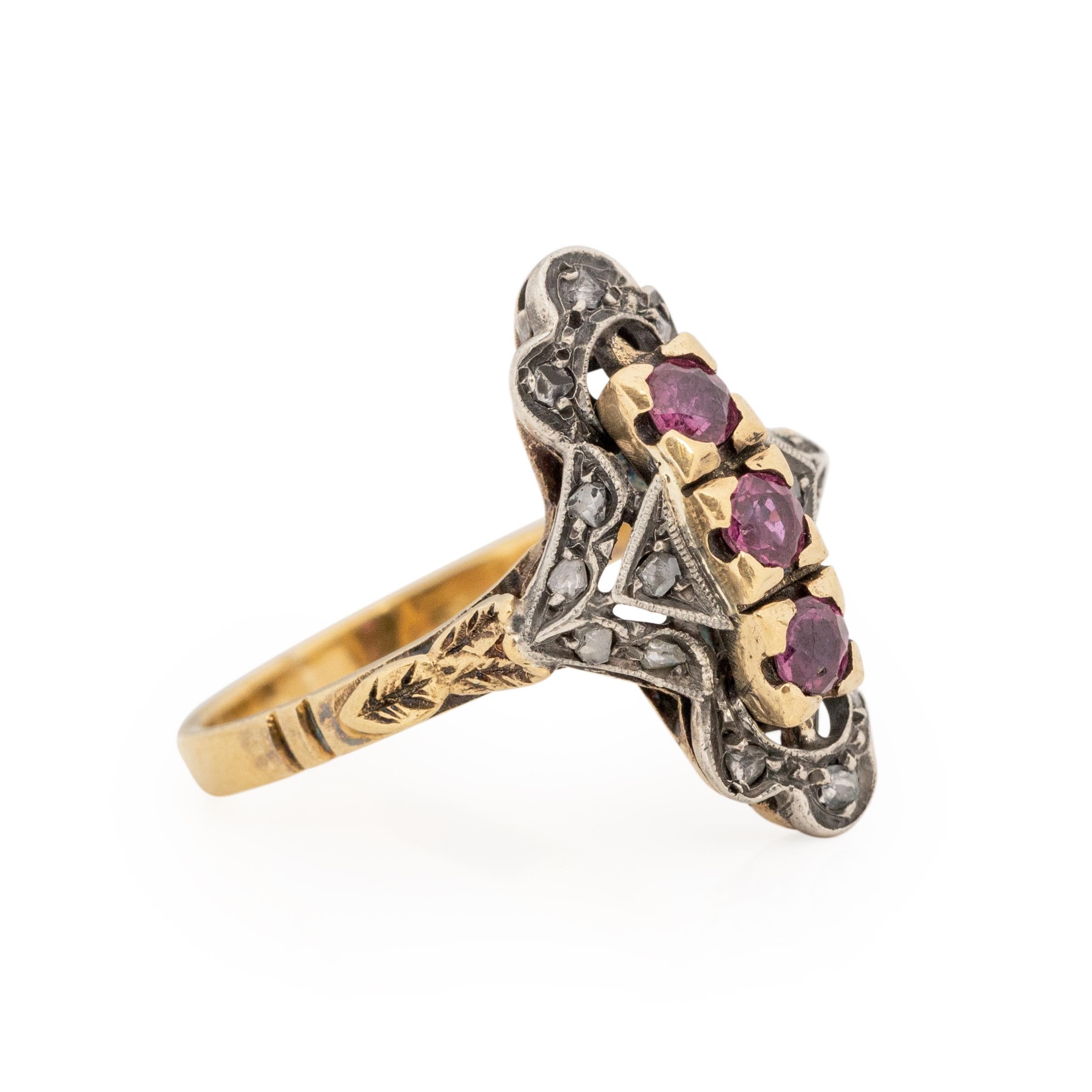 Here we have a classic Victorian beauty, this three stone ruby ring is a beautiful work of art in great condition for its age. With a two tone look this ring is crafted in 18K white and yellow gold. Starting at the yellow gold shanks that have