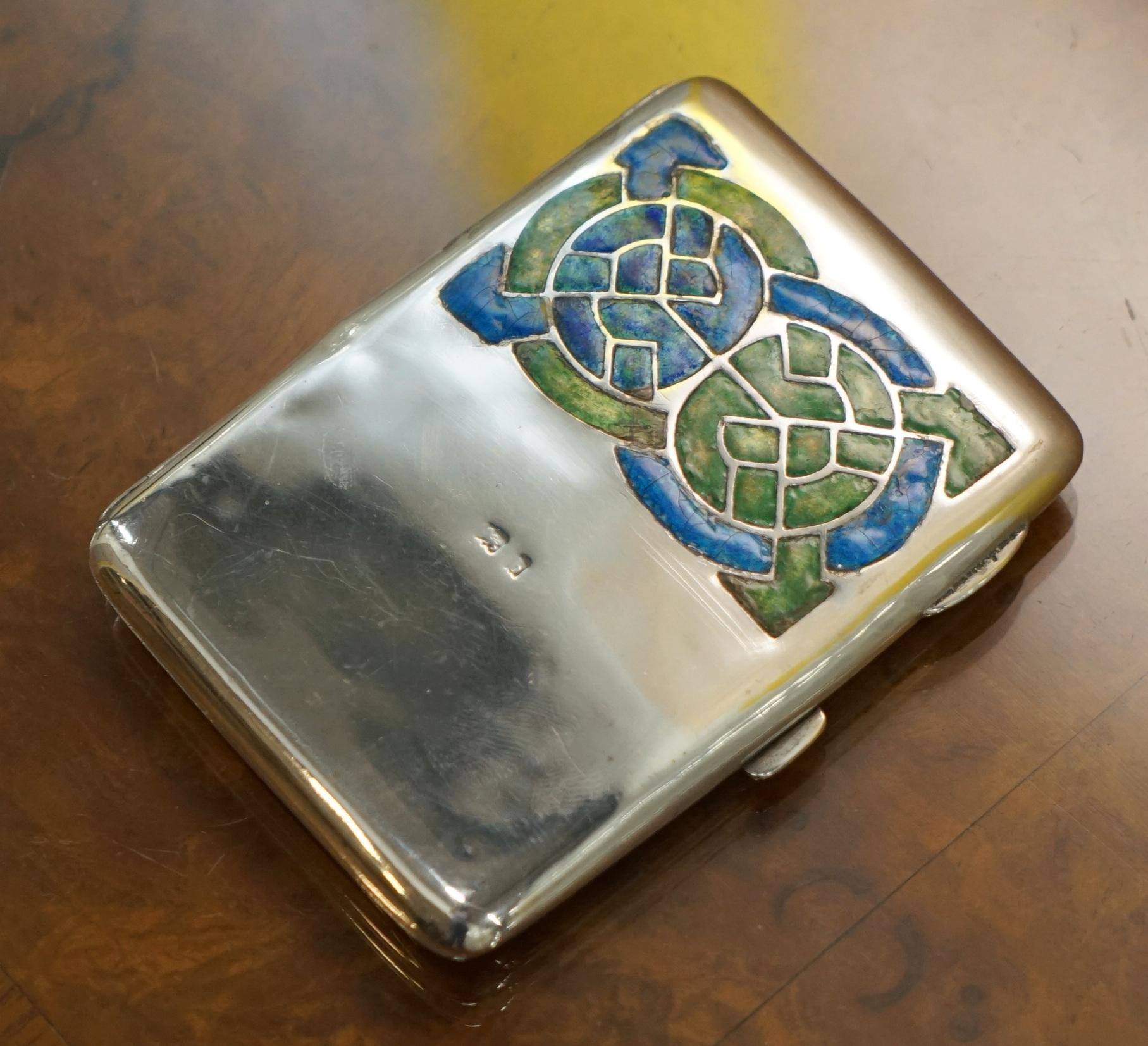 We are delighted to this stunning original 1901 Archibald Knox Cymric Liberty & Co Sterling Silver and Enamel cigarette case

A stunning and very collectable piece of Liberty’s sterling silver and Enamel made by the great Archibald Knox

The