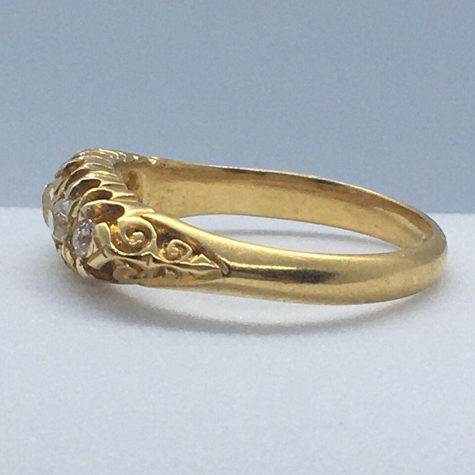1901 British 18K Yellow Gold Filigree Carving 1/2 Carat TDW Diamond Ring

Finger Size 6.5
Hallmarks Crown, 18, Chester, fancy A, all translates to; 1901, made in U K
Condition Ring looks never sized, no chips, no damage, no repairs, see pictures
