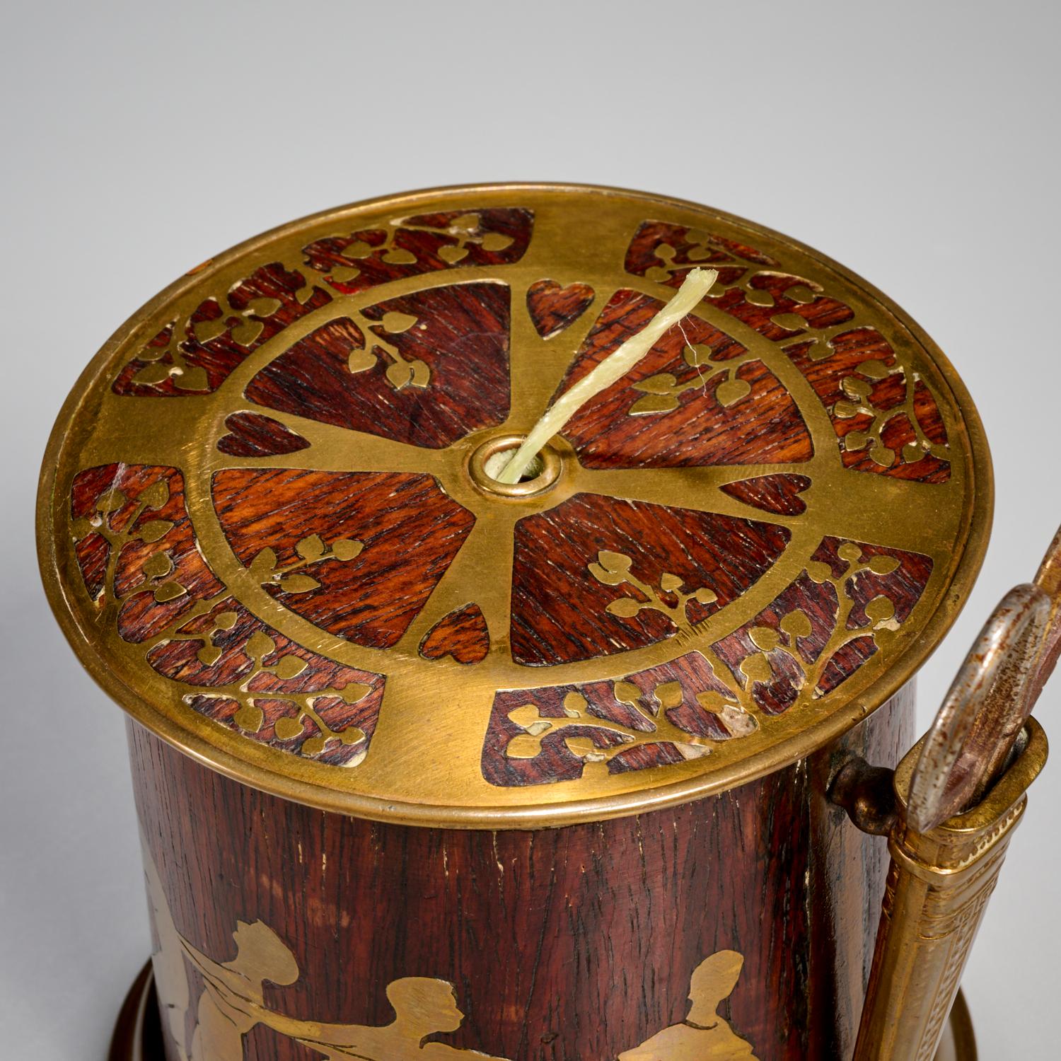 Circa 1901, Erhard & Söhne, Germany, a Jugendstil/Art Nouveau brass and rosewood string box, decorated in the round with children playing tug-of-war. The lid is beautifully decorated in brass with leaf and heart motifs. The interior is also polished