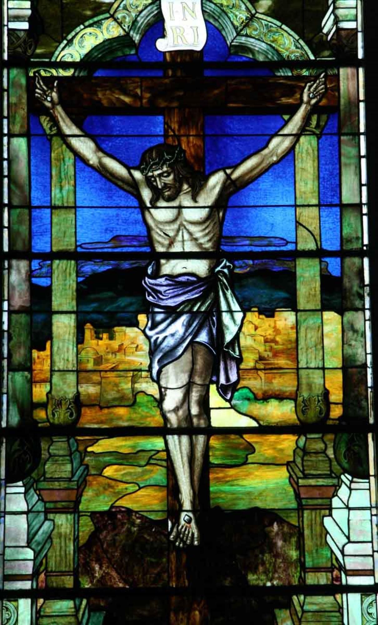 This stained glass window of our Lord Jesus being crucified on account of our sins was removed from a 1901 western Pennsylvania church. Almost 20 feet high and almost 6 feet wide it consists of seven panels. This listing is for just the stained