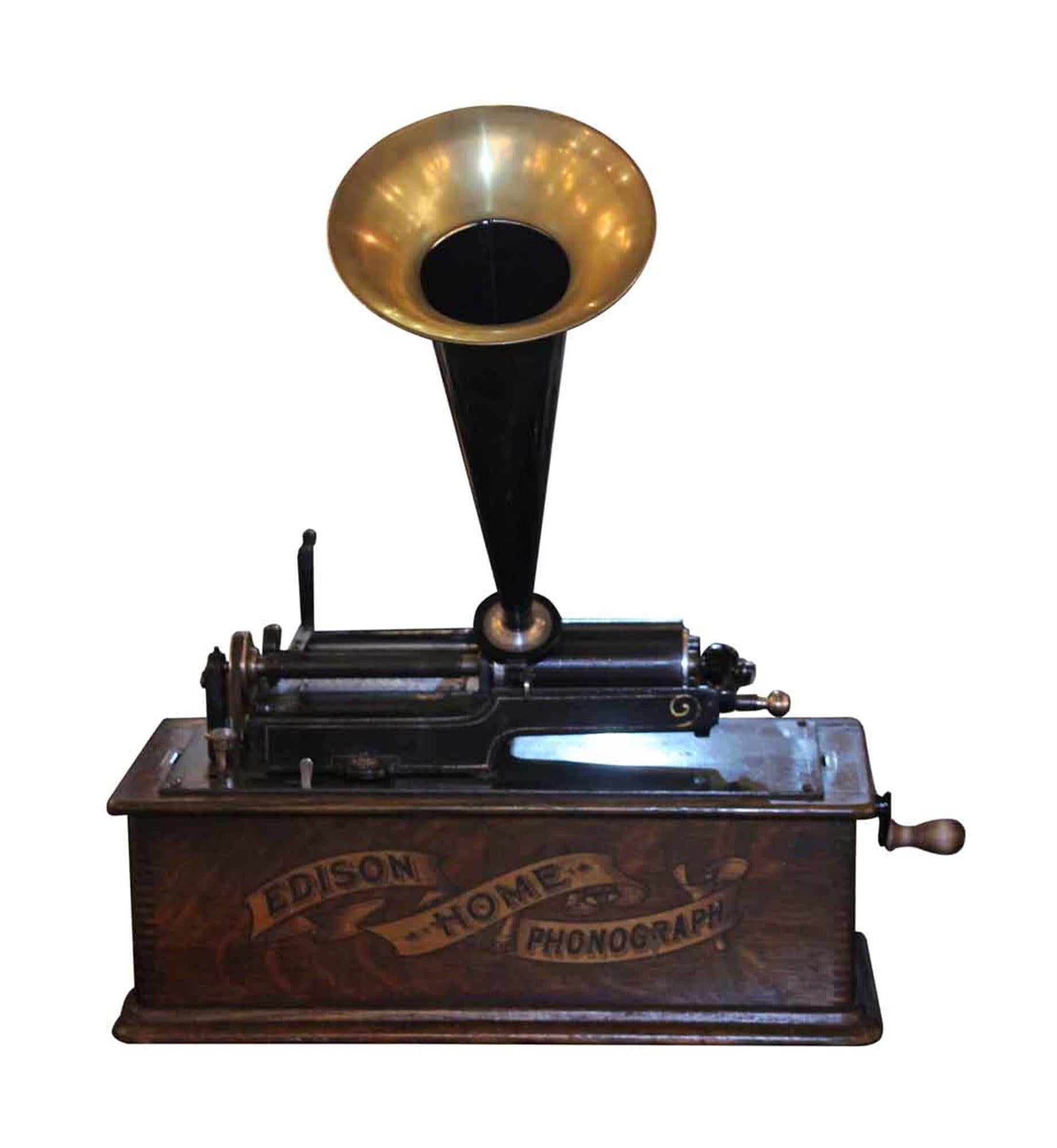 Long case working home phonograph made by Edison, circa 1903-1904. Serial number H120036. This can be seen at our 2420 Broadway location on the upper west side in Manhattan.