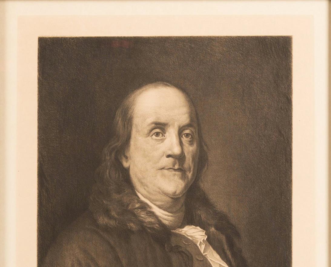 Presented is a Jacques Reich etched head and shoulders portrait of Benjamin Franklin. Reich completed the portrait in 1903. 

Jacques Reich was Hungarian-born portrait etcher, active mainly in the United States. After studying at the National