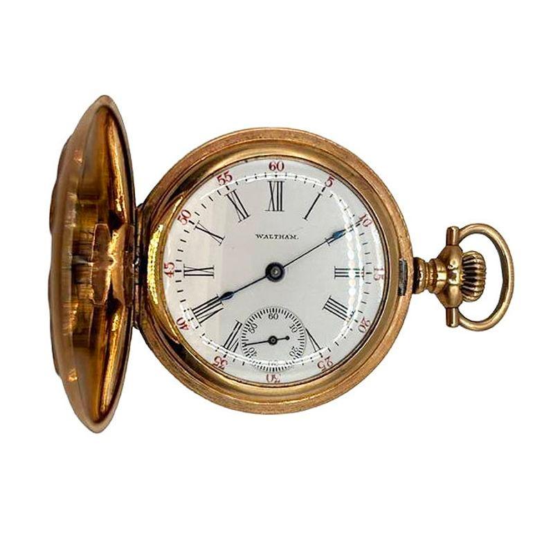 Original turn-of-the-century Art Nouveau portrait pocket Gold-filled watch by Waltham featuring a portrait of a female nymph with flowing locks of hair over flowers with matching floral along the back. Its enamel dial, adorned with fine numerals and