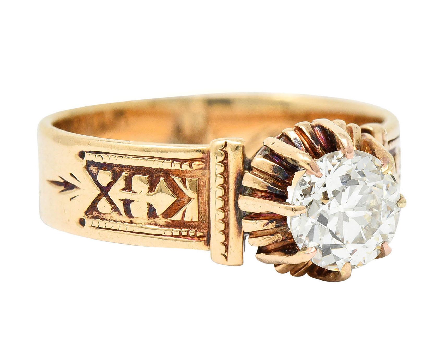 Centering an old European cut diamond weighing 0.93 carat - L color and SI2

Talon set in a high and stylized head and flanked by deeply engraved shoulders

Depicting hand applied milgrain and a fleur-de-lis motif

Tested as 14 karat gold

With