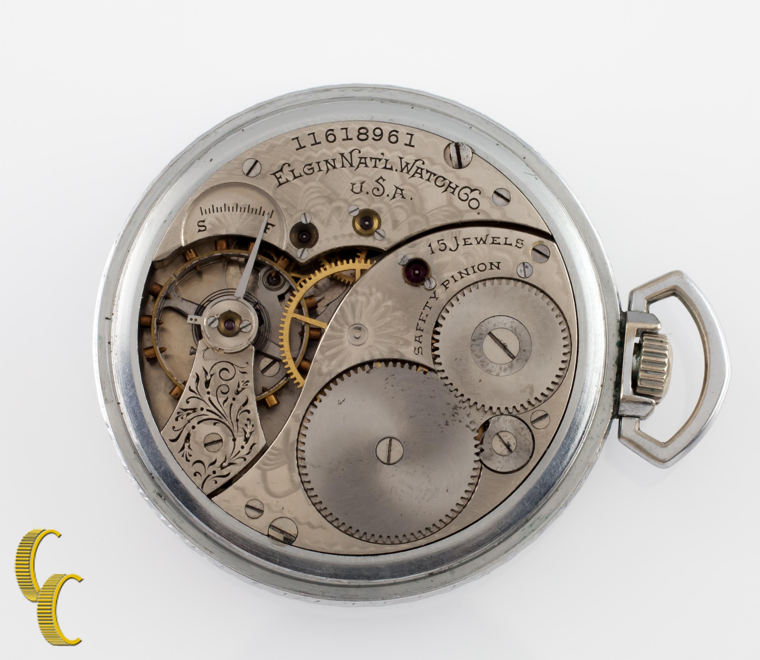 Beautiful antique Elgin pocket watch with off-white dial.
Black hands and a dedicated seconds dial.
Nickel case with intricate hand-etched design on case.
Black numbers and markers.
Case serial # 35347.
15-jewel Elgin movement serial #