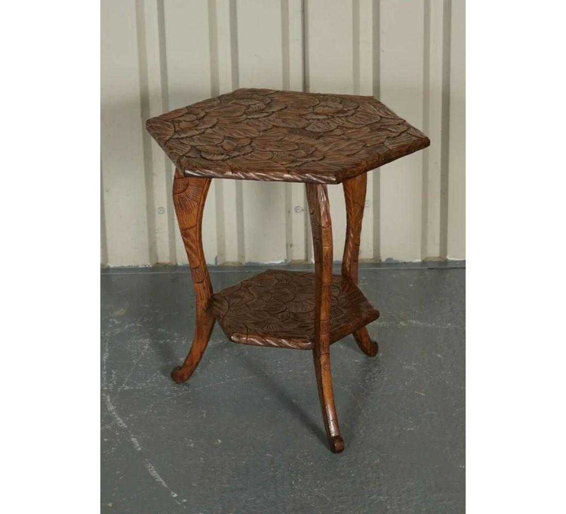 We are delighted to offer for sale this beautiful Liberty's & Co Hexagonal hand carved end table.

Solid and well made, beautifully crafted with floral design. Its hand carved from top to bottom with floral detailing.

I have variations of these
