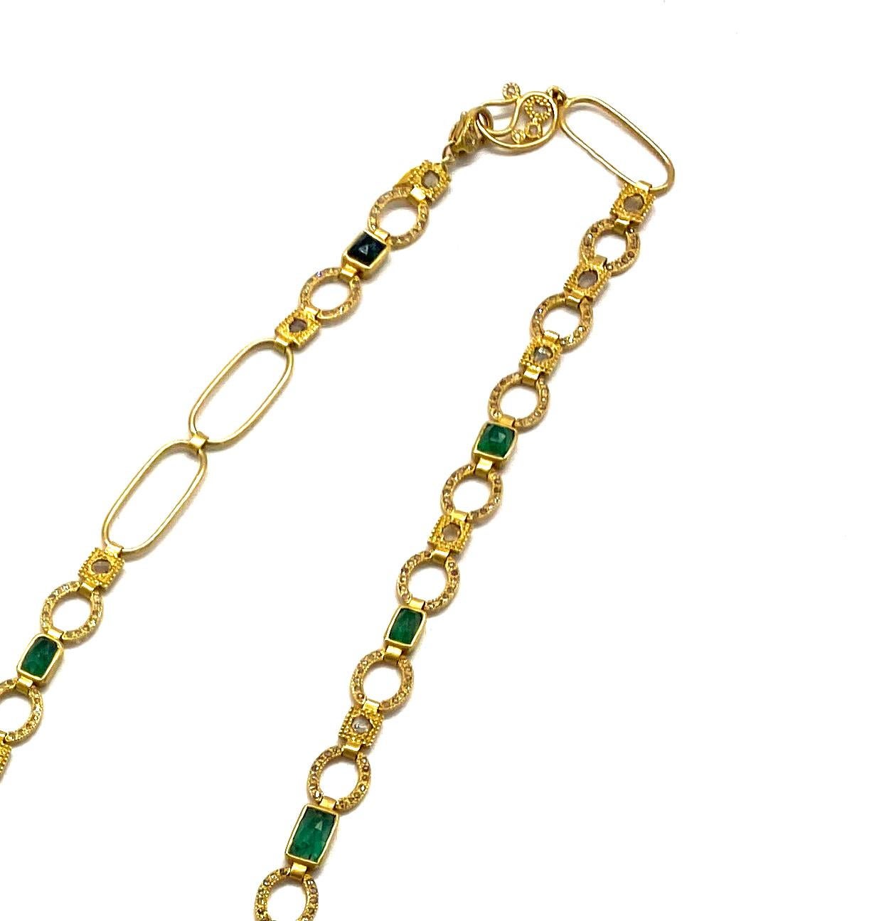 Elegant Art Deco style Mosaic 32 Inch Necklace set in 20 Karat Yellow Gold with Emerald weighing approximately at 19.06cts and Diamonds 4.62cts. Brought to your from the Luminosity Collection which consists of bold design and reflects light from