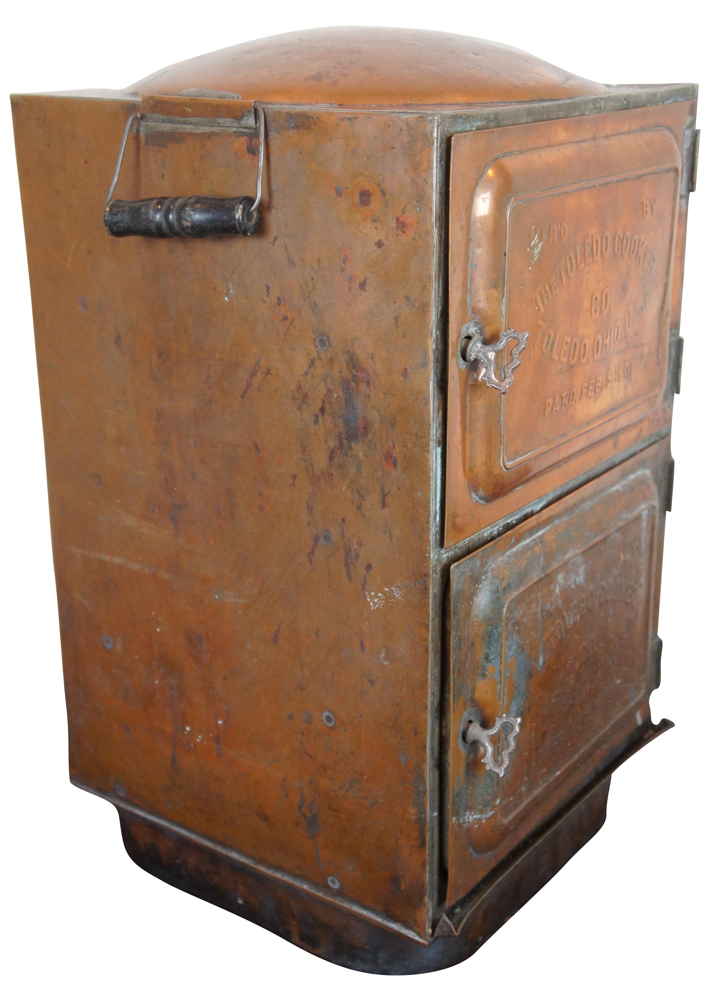 Rare antique copper Toledo cooker canning steamer oven. Made of copper featuring two doors with four interior racks. Circa 1907.
 