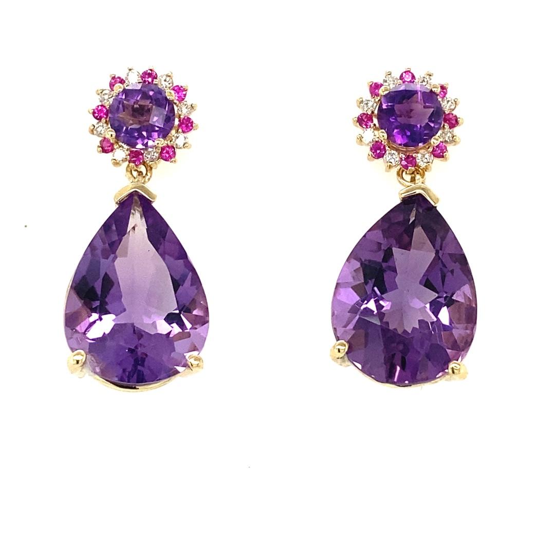 Amethyst, Pink Sapphire and Diamond Drop Earrings! 

These stunning Earrings have 2 large Pear Cut Amethysts that weigh 16.99 Carats and 2 Round Checkered Cut Amethysts that weigh 1.59 Carats. 
 The Round Amethysts are embellished with alternating