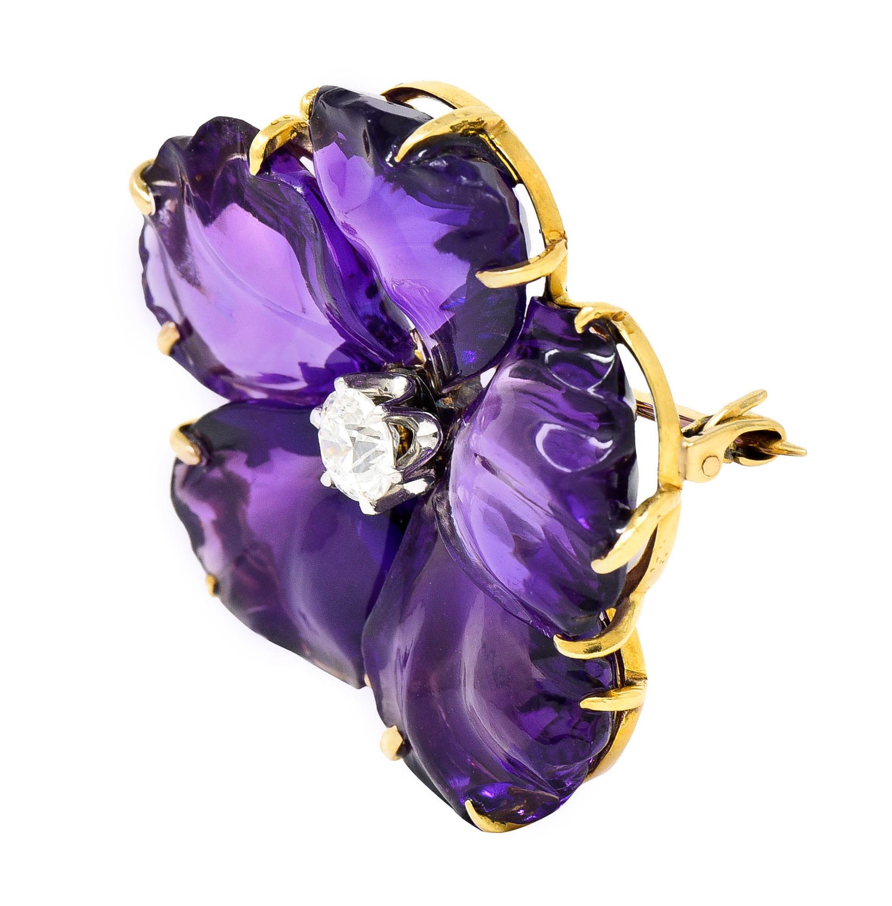 Brooch is designed as a flower with hand carved amethyst petals - robustly purple in color

Each talon set while centering a transitional cut diamond weighing approximately 0.50 carat - H/I color with SI1 clarity

Talon set in a platinum