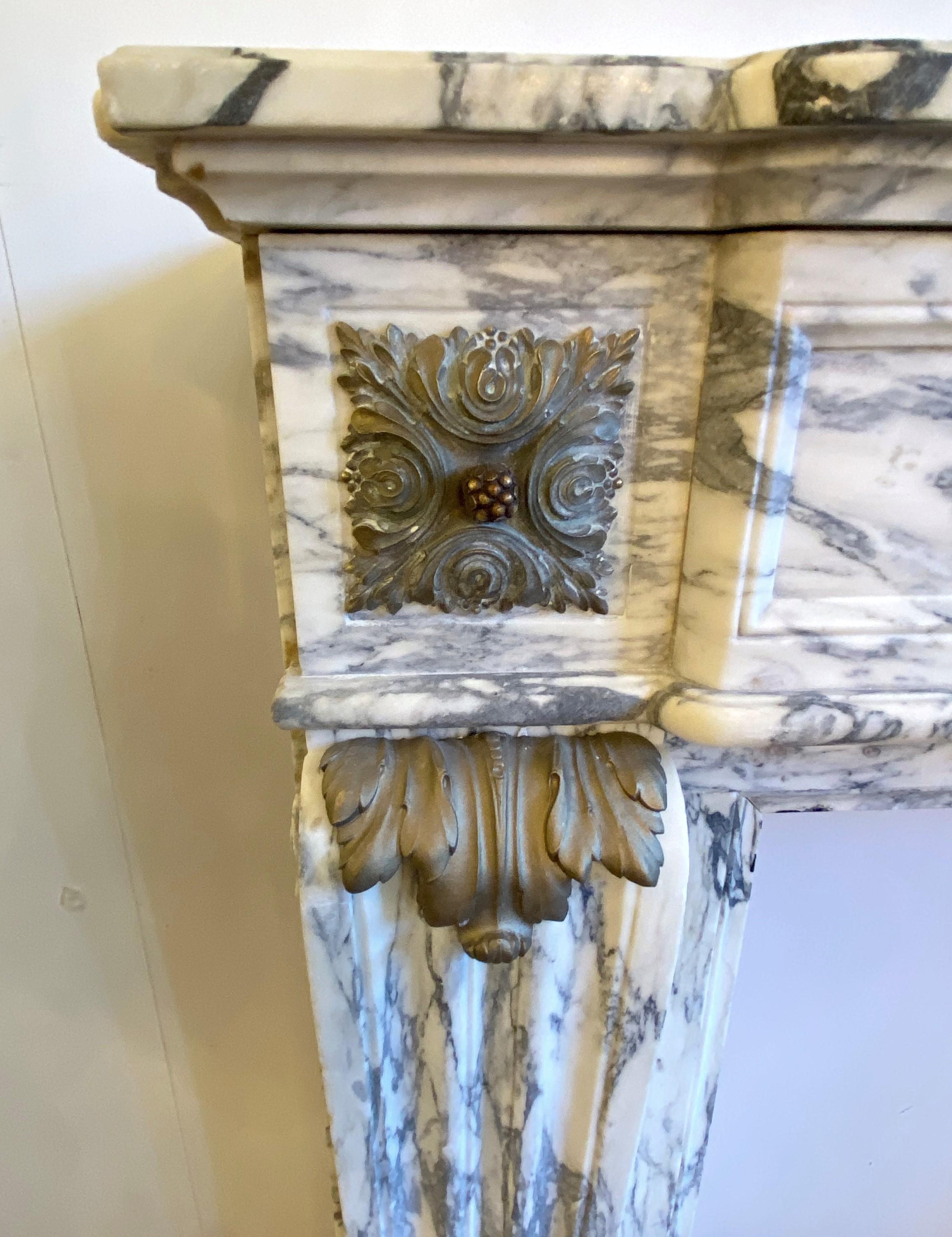 Hand-Carved 1907 NYC Plaza Hotel Carved Marble Mantel Bronze Details For Sale
