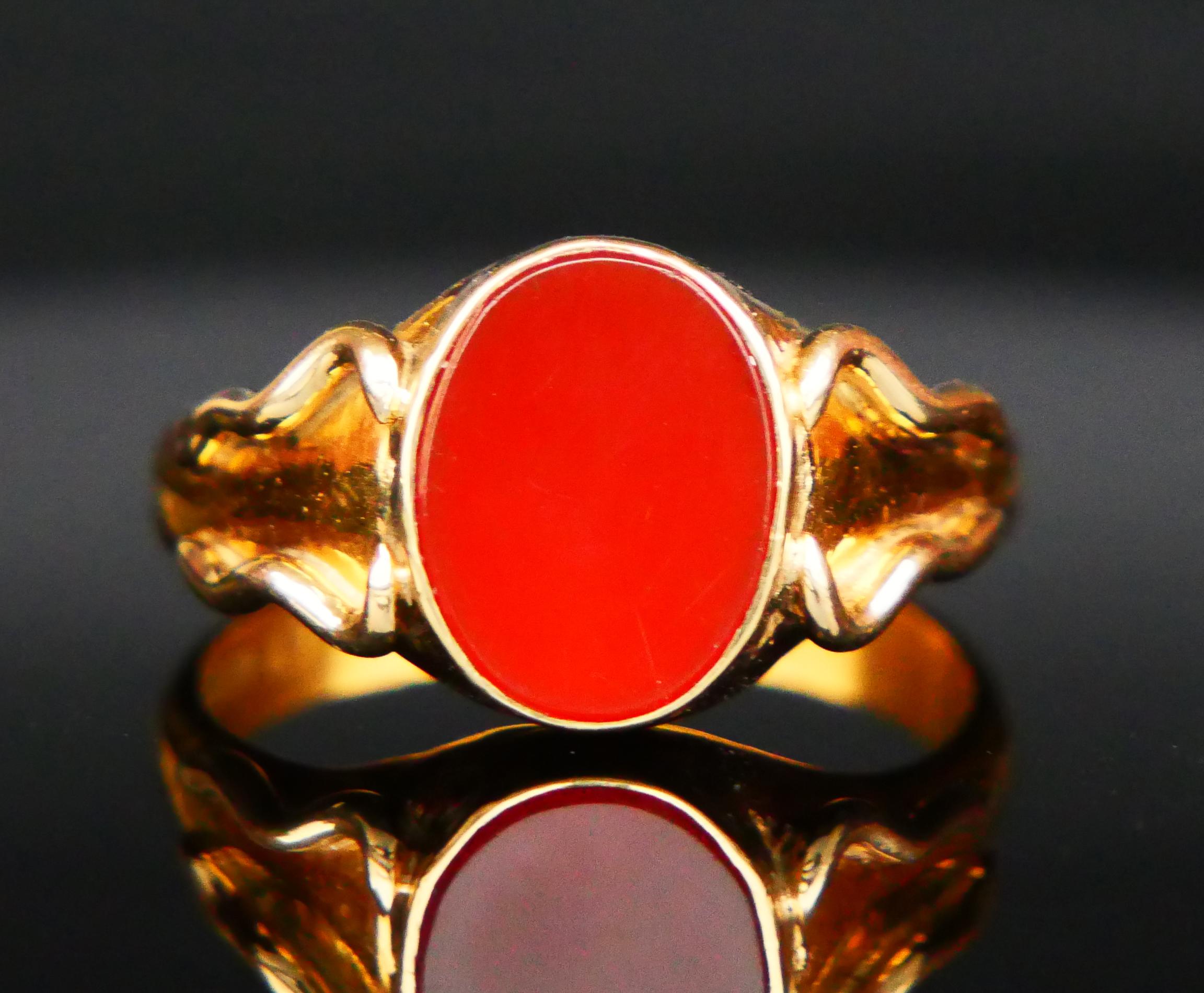 Signet Ring for Men or Women crafted in solid 23K Gold with dark Red plate of Carnelian stone 13 mm x 10 mm x 2.75 deep / ca 3 ct. Stone has well polished flat surface. Shoulders with wavy ornaments. The band is 4mm wide.

Swedish hallmarks, 23K,