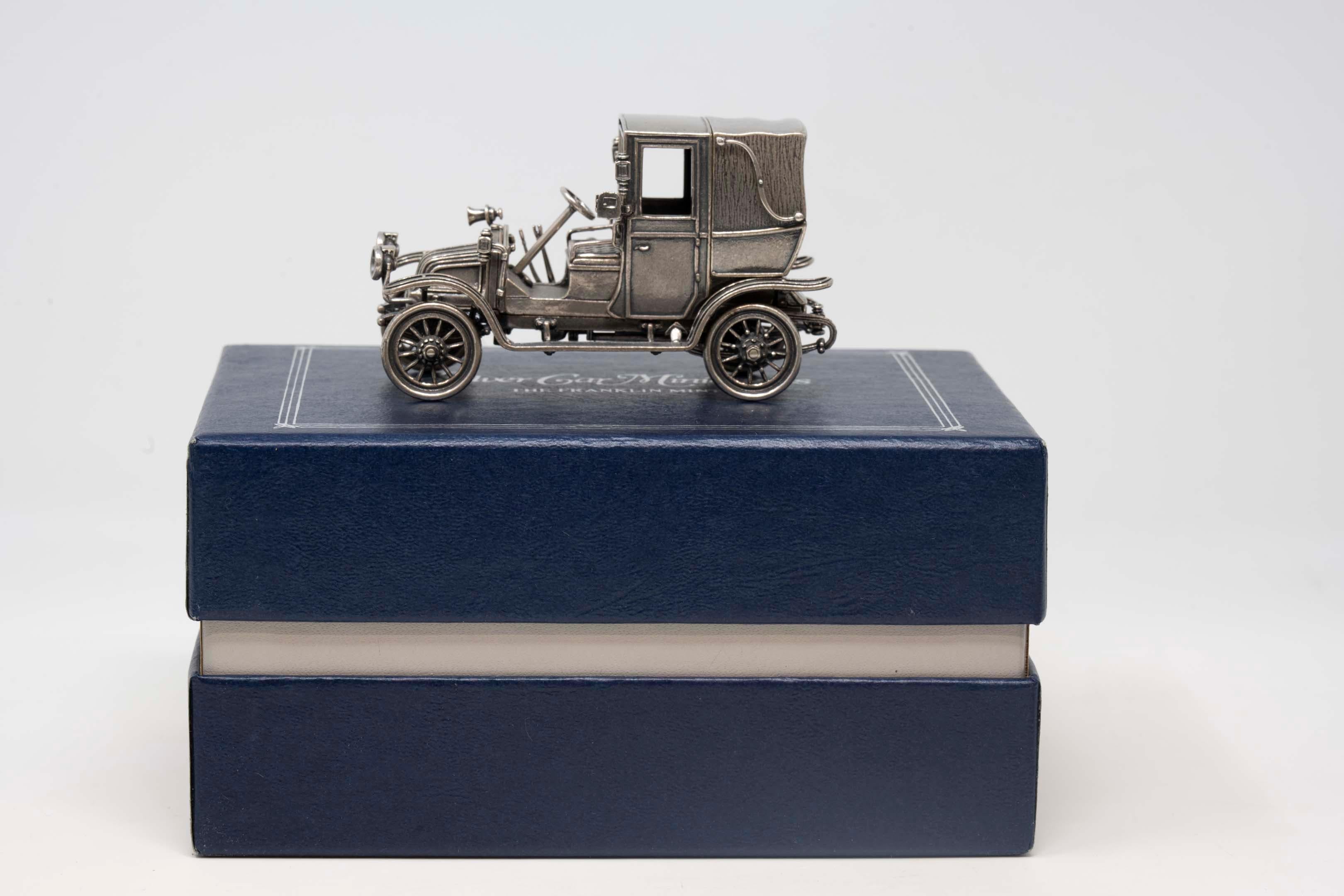 Franklin Mint 1907 Thomas Flyer sterling silver miniature car with box. Measures 3 1/2 inches long x 2 inches tall x 1 1/2 inches wide. Made in the 70s-80s, hallmarked and in good condition. Weighs 182.5 grams.
