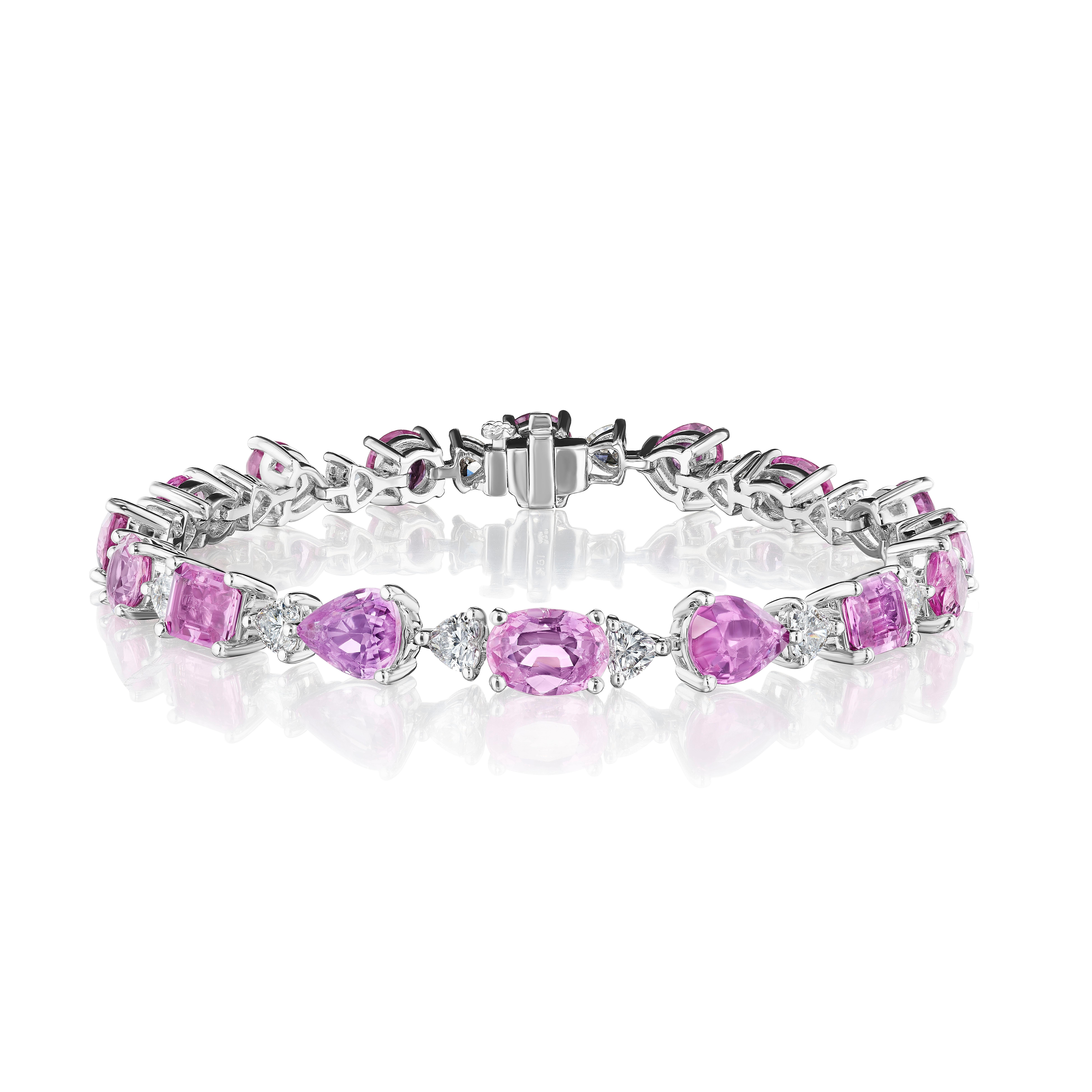 •	18KT White Gold
•	19.07 Carats
•	7” Long

•	Number of Pink Sapphires: 16
•	Carat Weight: 16.03ctw
•	Shapes: Round, Heart, Oval, Pear, Emerald Cut

•	Number of Heart Shape Diamonds: 16
•	Carat Weight: 3.04ctw

•	A beautiful mix of round, heart
