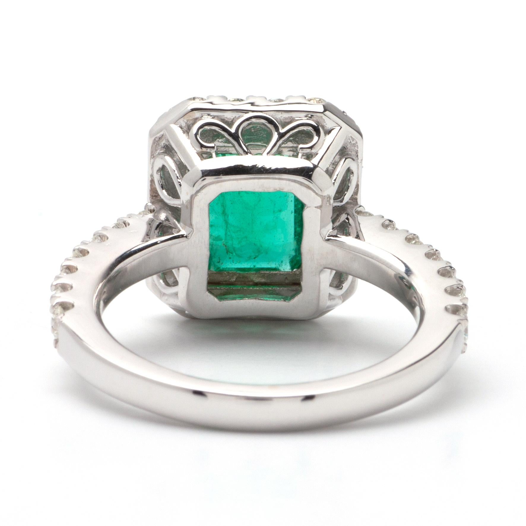Emerald Cut 1.90ct Emerald Halo Ring in 14K White Gold; .90ct Side Diamonds For Sale