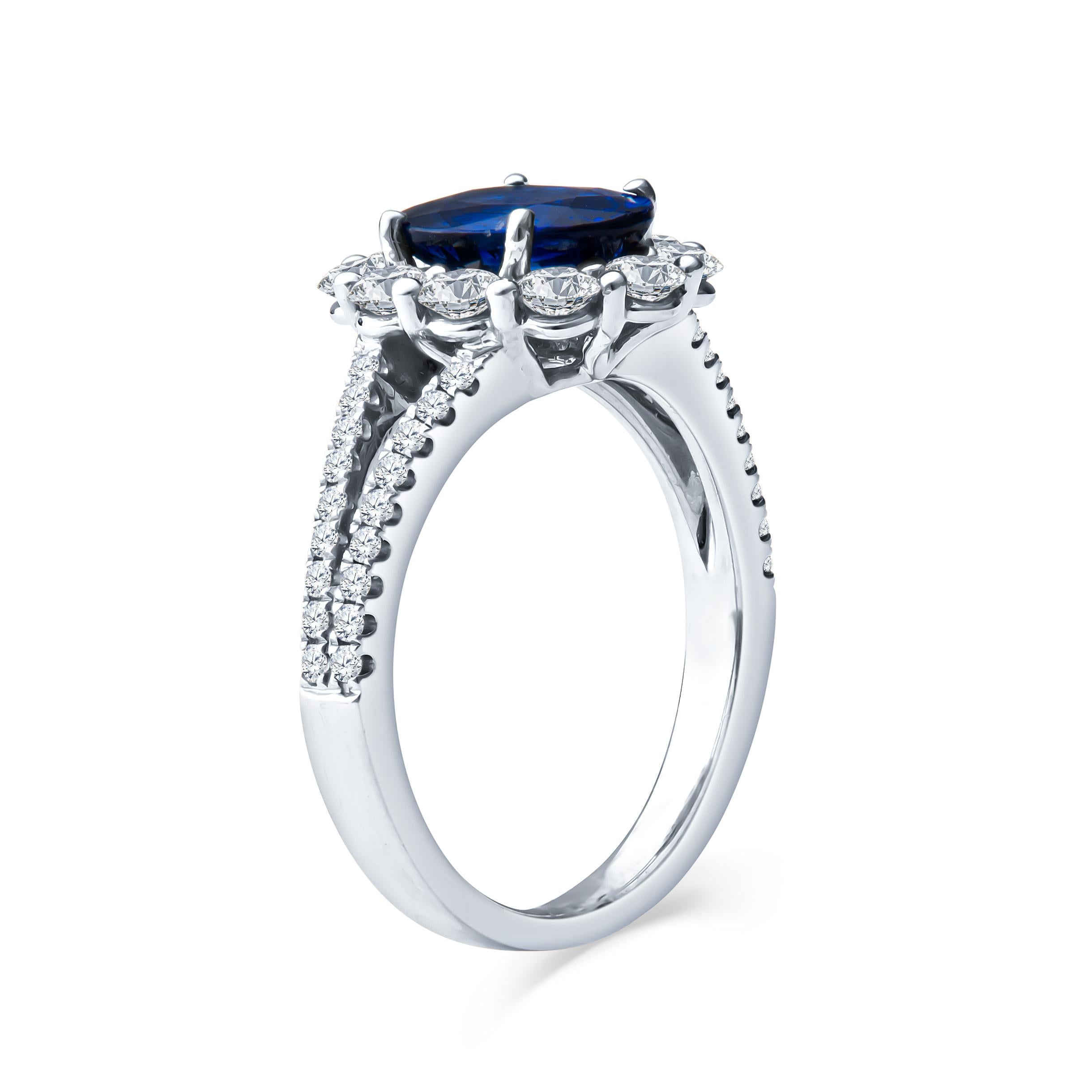 Oval Cut 1.90ct Oval Blue Sapphire and 1.12 Carat Round Diamond Halo 18kt White Gold Ring